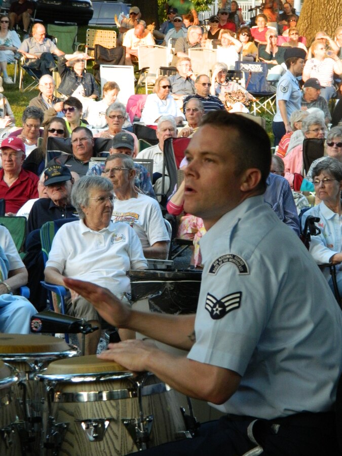 Senior Airman Simon Thomsen plays the congas during the rock band portion of the concert in Mountville, PA on June 22, 2014. (U.S. Air Force Photo/Technical Sgt. Dawn Hoffman)