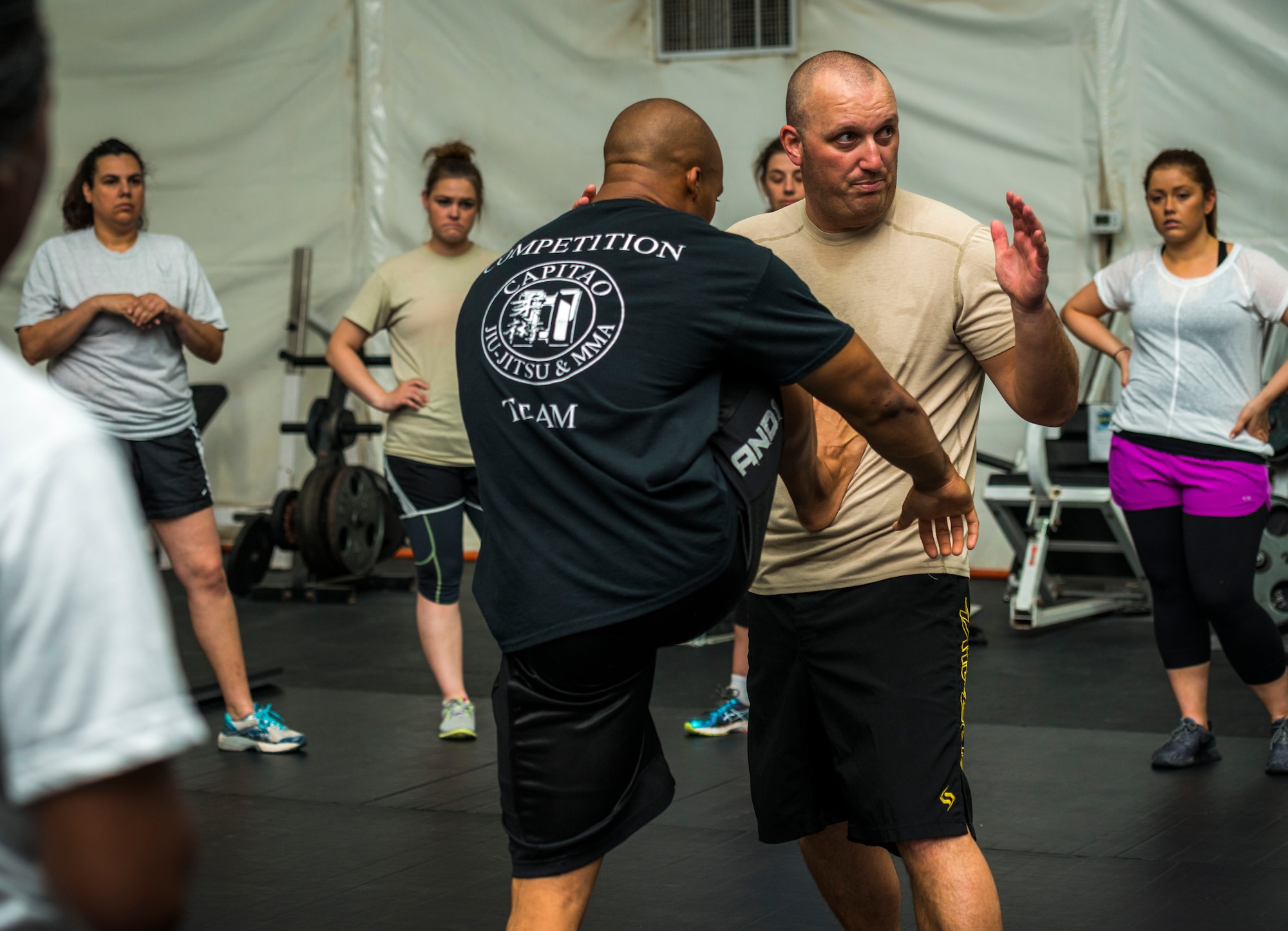 U.S. Air Force Staff Sgt. Cameron Cochran, 387th Expeditionary Security Forces Squadron assistant flight chief, demonstrates one way to push away an attacker during a self-defense class July 26, 2014 at an undisclosed location in Southwest Asia. The class was designed to better prepare Airmen if they are ever attacked. (U.S. Air Force photo by Staff Sgt. Jeremy Bowcock)