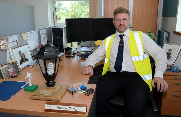 Steve Perry, 100th Civil Engineer Squadron base energy manager, recently won the 2014 Federal Energy and Water Management award for his holistic energy program July 30, 2014, on RAF Mildenhall, England. Perry is responsible for making sure all energy on RAF Mildenhall is used effectively. (U.S. Air Force photo/Airman 1st Class Dillon Johnston/Released)