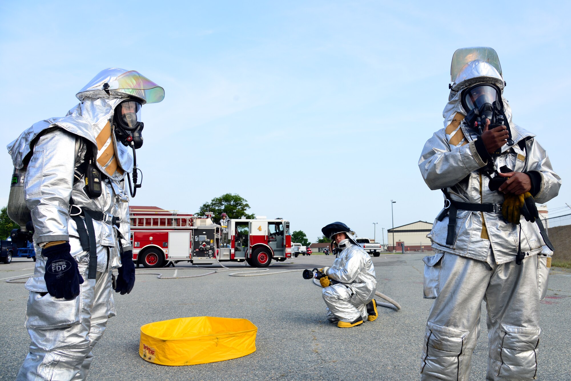 Firefighters from the 633rd Civil Engineer Squadron respond to a simulated fuel spill during an exercise at Langley Air Force Base, Va., July 31, 2014. In accordance with the Oil Pollution Act of 1990, contractors from the Defense Logistics Agency conduct annual oil spill exercises to evaluate the base’s response and recovery actions. (U.S. Air Force photo by Senior Airman Aubrey White/Released)