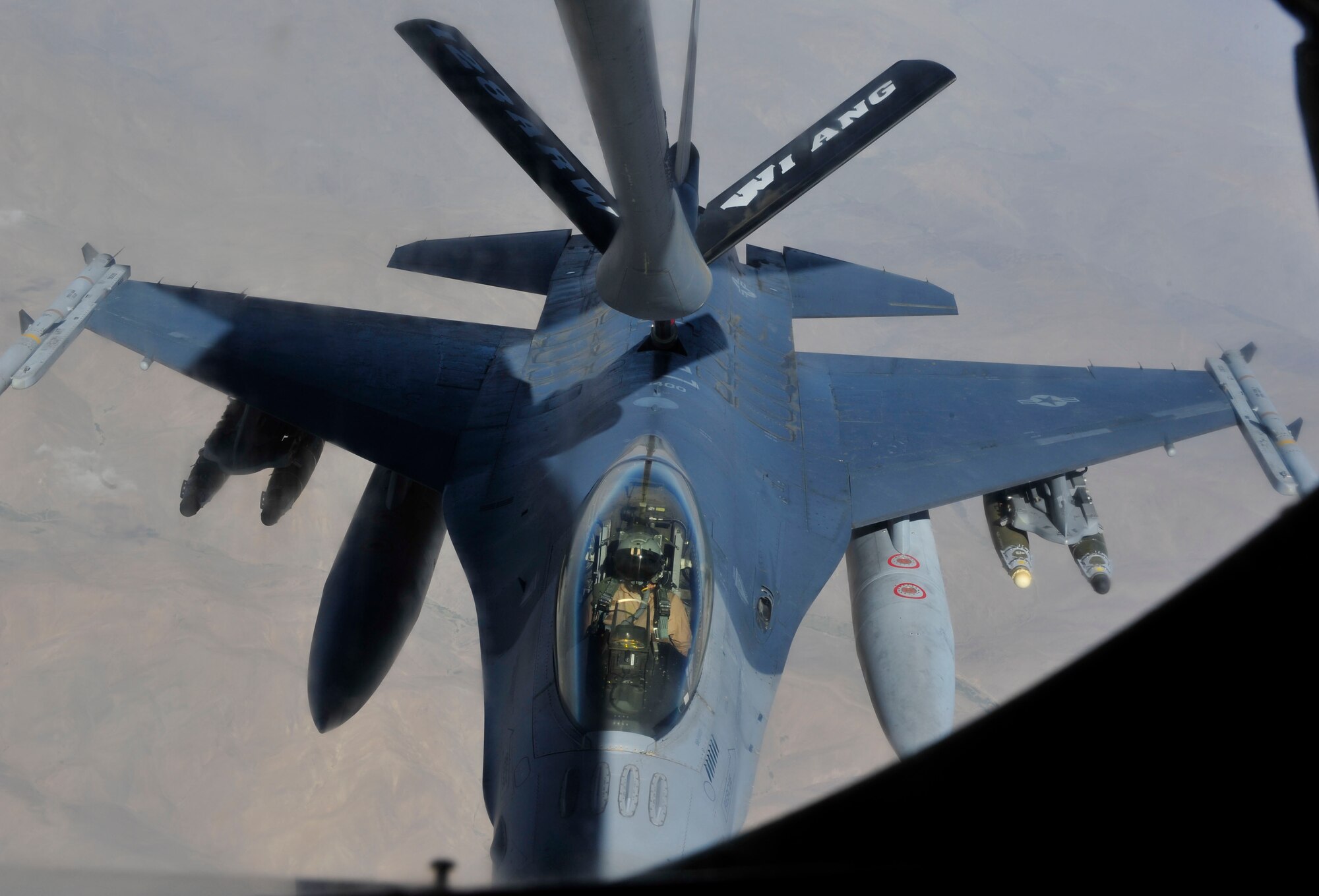 A F-16 Falcon assigned to Bahgram Airfield approaches a KC-135 Stratotanker, assigned to the 340th Expeditionary Air Refueling Squadron Detachment 1 from  Mazar-i-Sharif Airfield, fly in support of Operation Enduring Freedom, July 24, 2014. The General Dynamics F-16 Fighting Falcon is a single-engine multirole fighter aircraft originally developed by General Dynamics for the United States Air Force (U.S. Air Force photo by Senior Airman Colin Cates) 