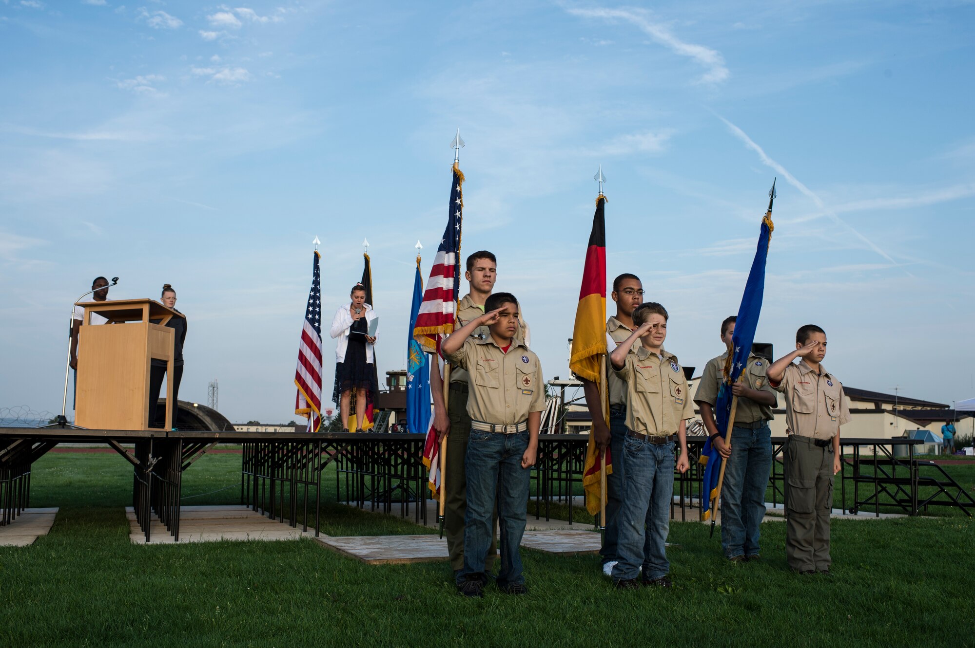 Boy Scouts of America Troop 165 present the colors during the opening ceremony of the Relay For Life event at Spangdahlem Air Base, Germany, Aug. 1, 2014. Relay For Life is an awareness event that allows participants to celebrate the lives of people who have battled cancer, remember loved ones lost and fight back against the disease. (U.S. Air Force photo by Staff Sgt. Christopher Ruano/Released)