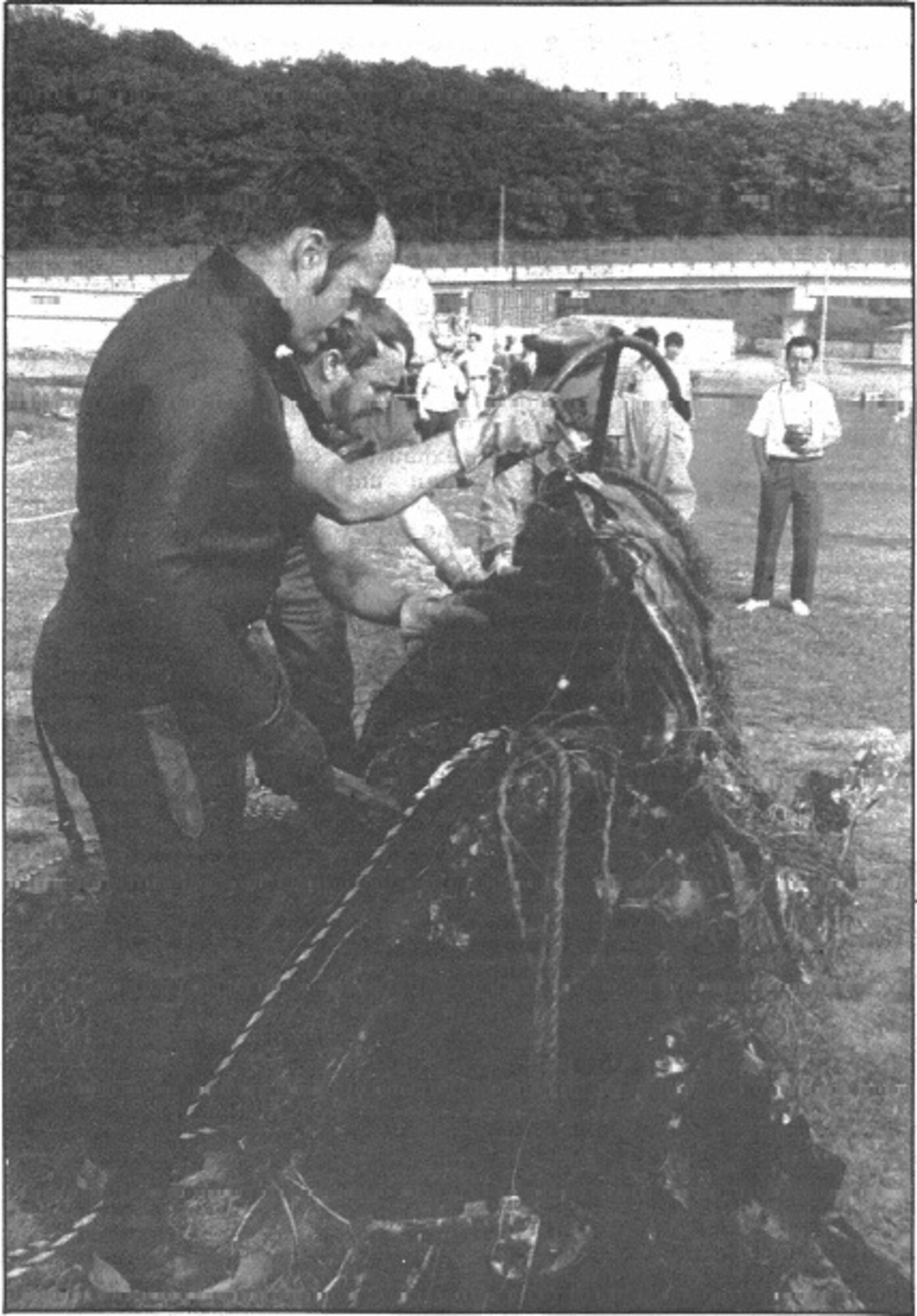 Divers retrieve an Air Force F-84G Thunderjet from Lake Ogawara in 1982.  (U.S. Air Force Photograph)