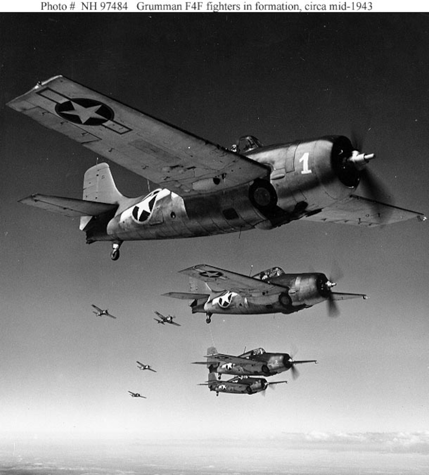 U.S. Navy, Grumman F4F Wildcat fighters in formation, circa mid-1943.  In August 1945, similar aircraft struck Misawa Air Base. (U.S. Navy photograph)