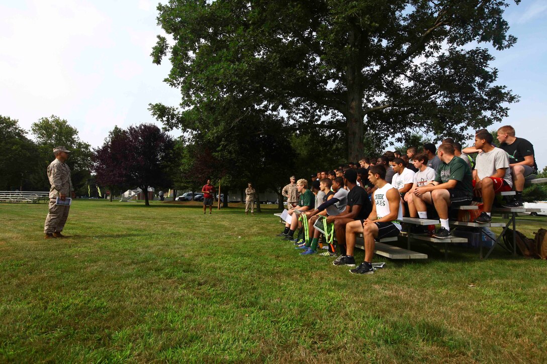 Athletes attending the Recruiting Station New Jersey Enhanced Leadership Seminar are briefed on what to expect and what is expected of them during the course at Naval Weapons Station Earle, Aug. 1. Recruiting Station New Jersey hosted a Leadership Seminar meant to impart Marine Corps leadership principles, discipline and camaraderie to members of the Cedar Creek High School football team. (United States Marine Corps photo by Lance Cpl. Brandon Thomas)