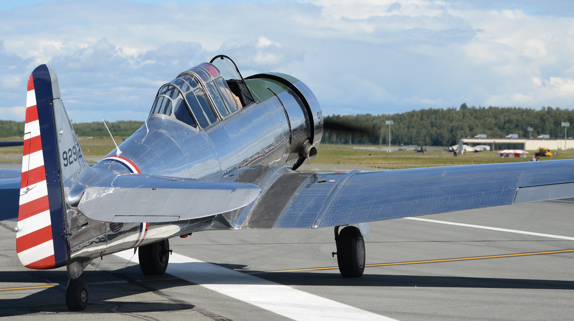 Lt. Col. Kevin Sutterfield, Reserve F-22 pilot assigned to the 477th Fighter Group, prepares to fly a T-6 Texan during the JBER Artic Thunder Open House July 27 as part of the warbirds demonstration. Sutterfield is a member of the Commemorative Air Force, an organization whose goal it is to preserve these WWII era aircraft in a fly-able state and demonstrate them around the state of Alaska. (U.S. Air Force Photo/Tech. Sgt. Dana Rosso)