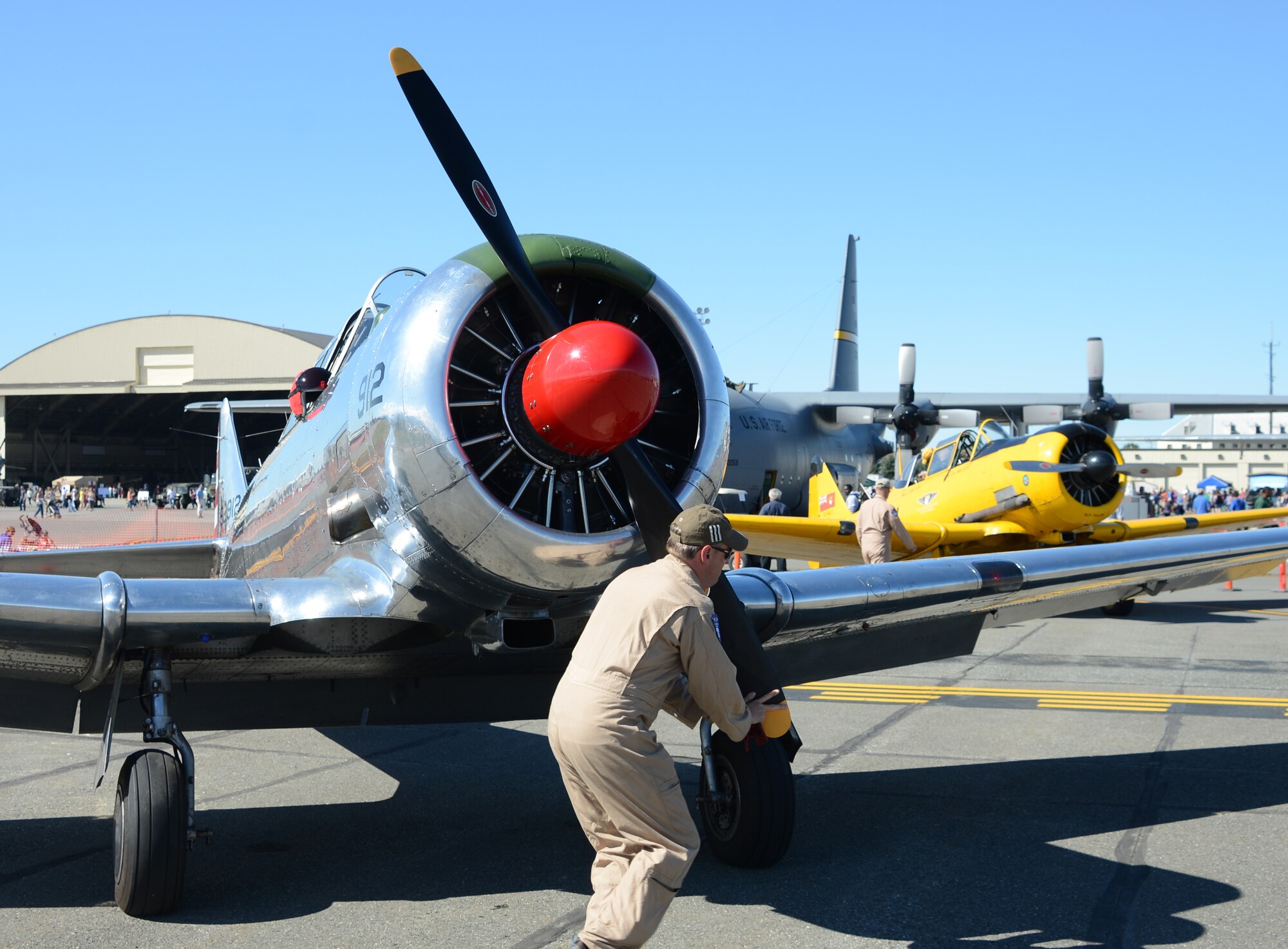 Lt. Col. Kevin Sutterfield, Reserve F-22 pilot assigned to the 477th Fighter Group, prepares to fly a T-6 Texan during the JBER Artic Thunder Open House July 27 as part of the warbirds demonstration. Sutterfield is a member of the Commemorative Air Force, an organization whose goal it is to preserve these WWII era aircraft in a fly-able state and demonstrate them around the state of Alaska. (U.S. Air Force Photo/Tech. Sgt. Dana Rosso)