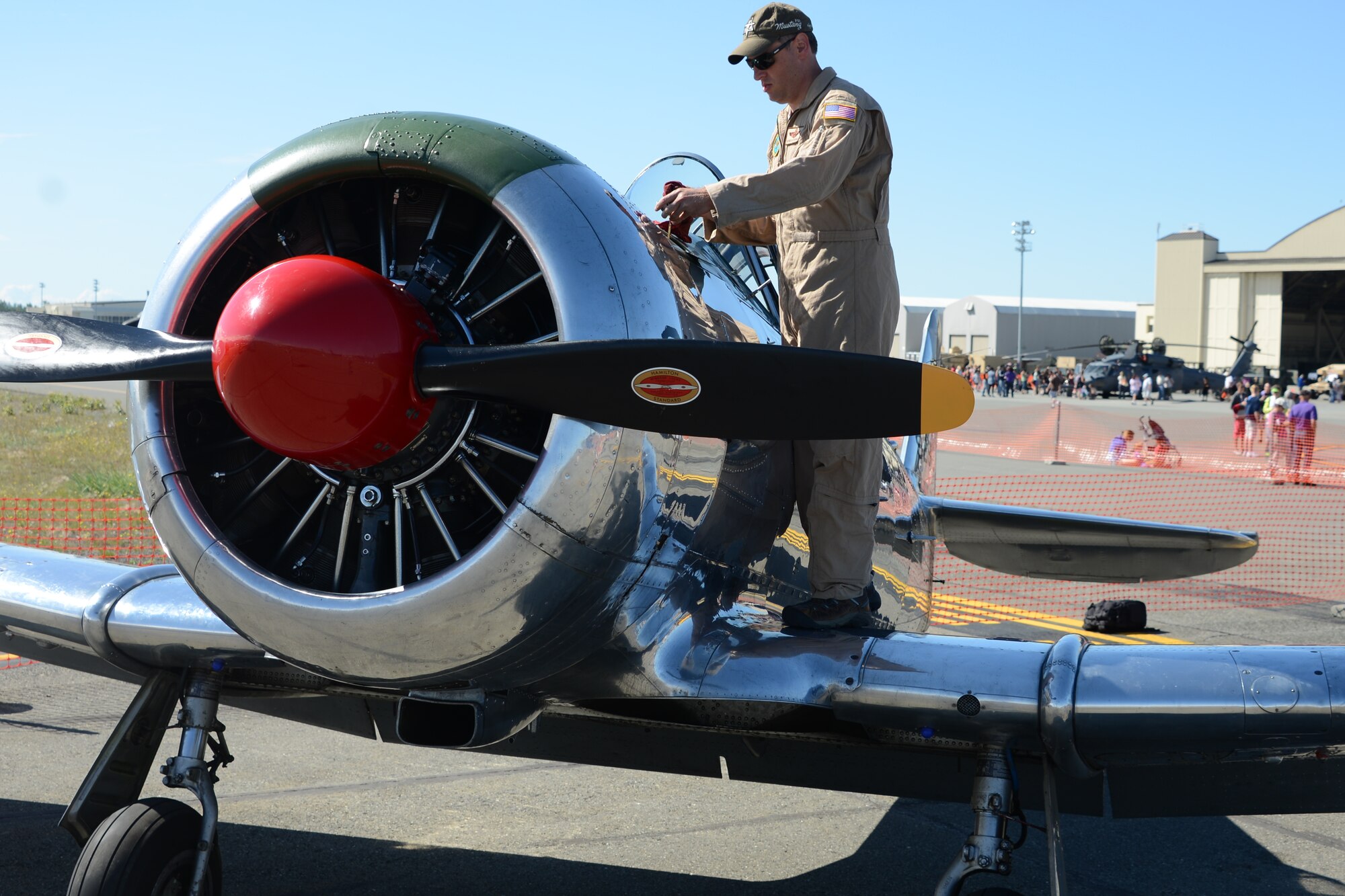 Lt. Col. Kevin Sutterfield, Reserve F-22 pilot assigned to the 477th Fighter Group, prepares to fly a T-6 Texan during the JBER Artic Thunder Open House July 27 as part of the warbirds demonstration. Sutterfield is a member of the Commemorative Air Force, an organization whose goal it is to preserve these WWII era aircraft in a fly-able state and demonstrate them around the state of Alaska. (U.S. Air Force Photo/Tech. Sgt. Dana Rosso)