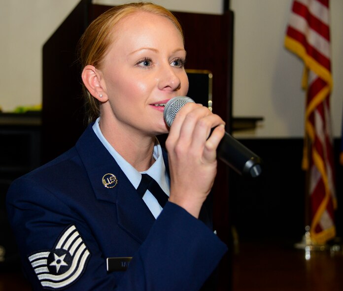 Tech. Sgt. Jasmin Taylor, 919 Special Operations Wing Public Affairs, sings the National Anthem during a retirement ceremony for a fellow Duke officer. (U.S. Air Force photo/Tech. Sgt. Cheryl Foster)