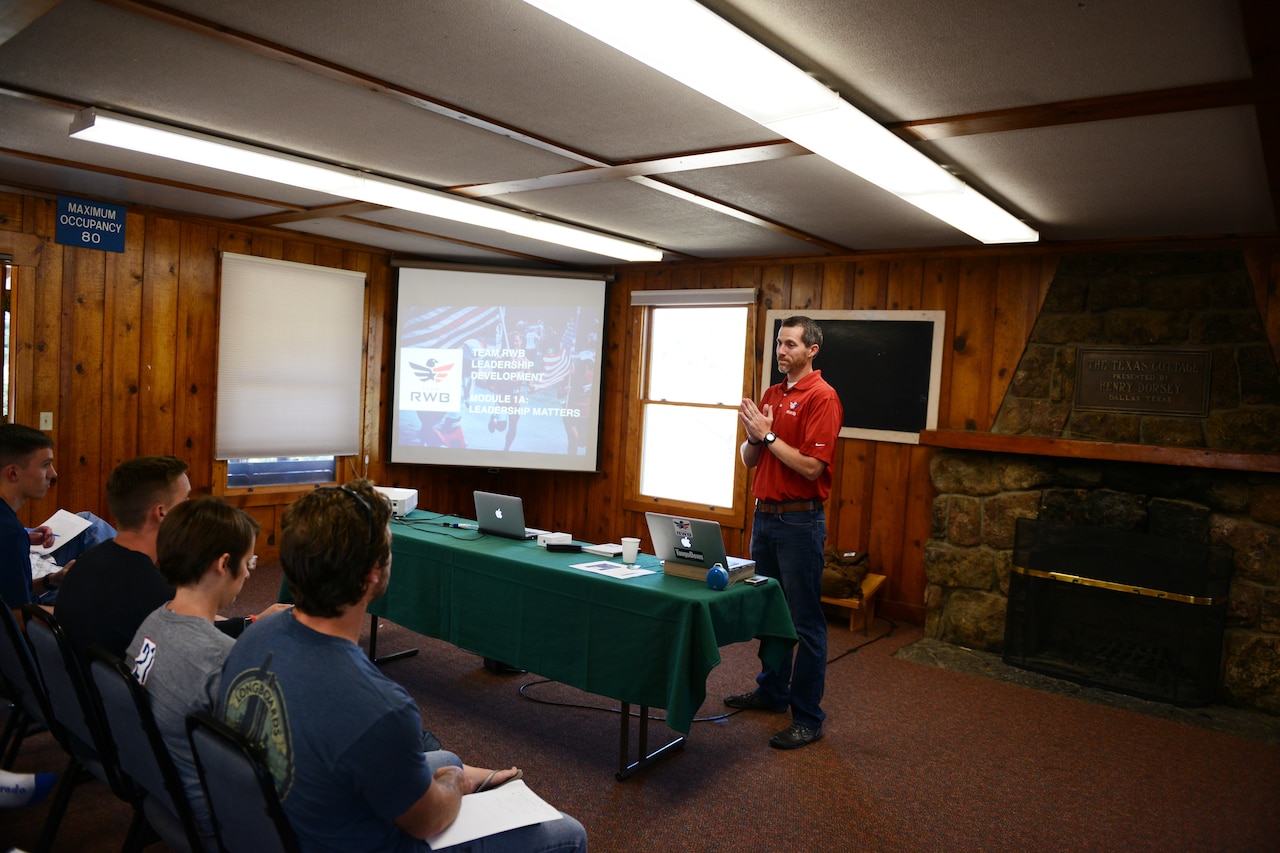 J.J. Pinter, director of operations for Team Red, White and Blue, an organization partnered with the United Service Organizations to enrich the lives of veterans, holds a leadership seminar during a rock-climbing camp in Estes Park, Colorado, Aug. 2. DoD photo by Army Sgt. 1st Class Tyrone C. Marshall Jr.