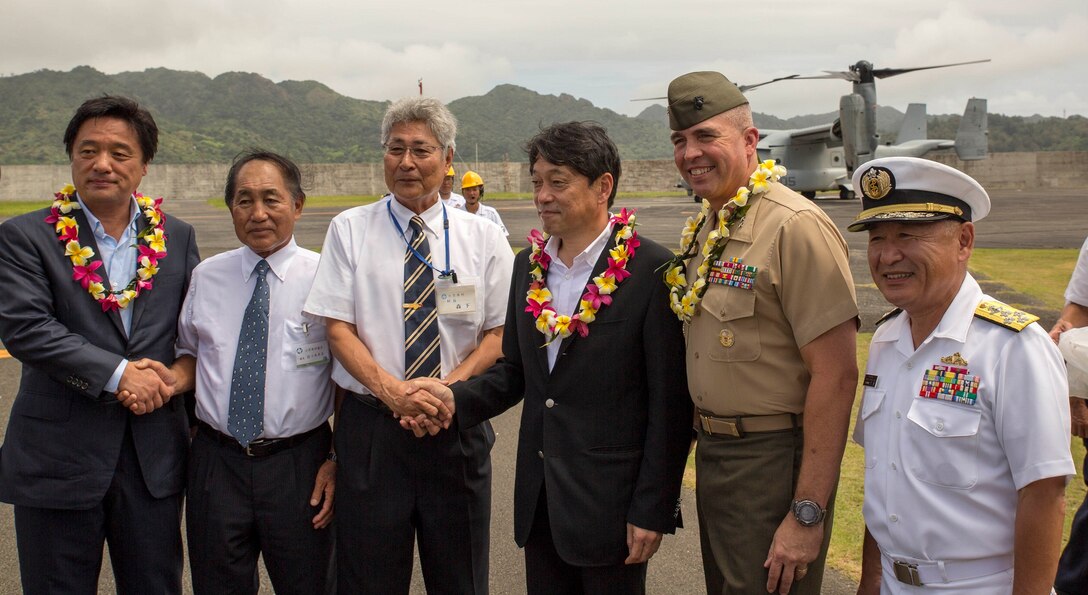 From left to right, Kenji Wakamiya, Yukimi Sasaki, Kazuo Morishita, Itsunori Onodera, U.S. Marine Lt. Gen. John Wissler and Japan Maritime Self-Defense Force Adm. Katsutoshi Kawano pose for a photo July 28 on Chichi Jima, Japan. Onodera, Wakamiya, Kawano and Wissler arrived to Chichi Jima via an MV-22B Osprey tiltrotor aircraft to demonstrate the long-range and quick response capabilities of the aircraft in the event of humanitarian assistance and disaster relief efforts. Wakamiya is the parliamentary vice minister of defense. Morishita is the Ogasawara village mayor, and Sasaki is the chairman of the Ogasawara village assembly. Onodera is the minister of defense for Japan. Kawano is the chief of staff for the JMSDF, and Wissler is the commanding general of III Marine Expeditionary Force. The Ospreys and crew are with Marine Medium Tiltrotor Squadron 265, Marine Aircraft Group 36, 1st Marine Aircraft Wing, III MEF.