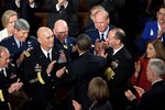 President Barack Obama greets the Joint Chiefs of Staff as he arrives to
deliver the State of the Union address in the House Chamber at the U.S. Capitol in Washington, D.C., Jan. 24, 2012. The chief of the National Guard Bureau, Air Force Gen. Craig McKinley, the second person in uniform from the right in the photo, joined his colleagues on the Joint Chiefs of Staff to hear the address. President Obama signed legislation making the CNGB a statutory member of the Joint Chiefs of Staff on Dec. 31, 2011.