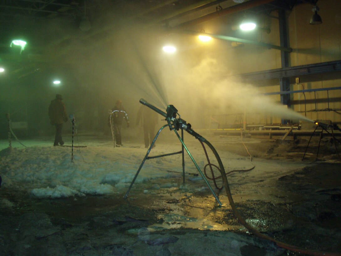 In a refrigerated room at the ERDC Cold Regions Research and Engineering Laboratory’s Ice Engineering Facility, Snow Logic, a developer of snowmaking technologies recently compared snow guns for performance.