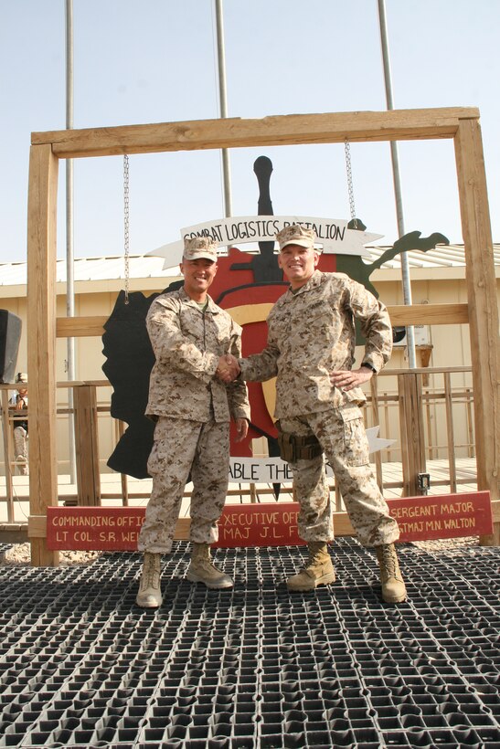 Lt. Col. Joon H. Um, left, commanding officer, Combat Logistics Battalion 1, shakes hands with Lt. Col. Sid R. Welch, commanding officer, CLB-7, after a transfer of authority ceremony held aboard Camp Leatherneck, Helmand province, Afghanistan, Aug. 1, 2014. Combat Logistics Battalion 1 replaced CLB-7 as the last unit to aid Regional Command (Southwest) with tactical-level logistical support and will close out another chapter in Marine Corps history as the last unit to serve as the logistics combat element for RC(SW).


