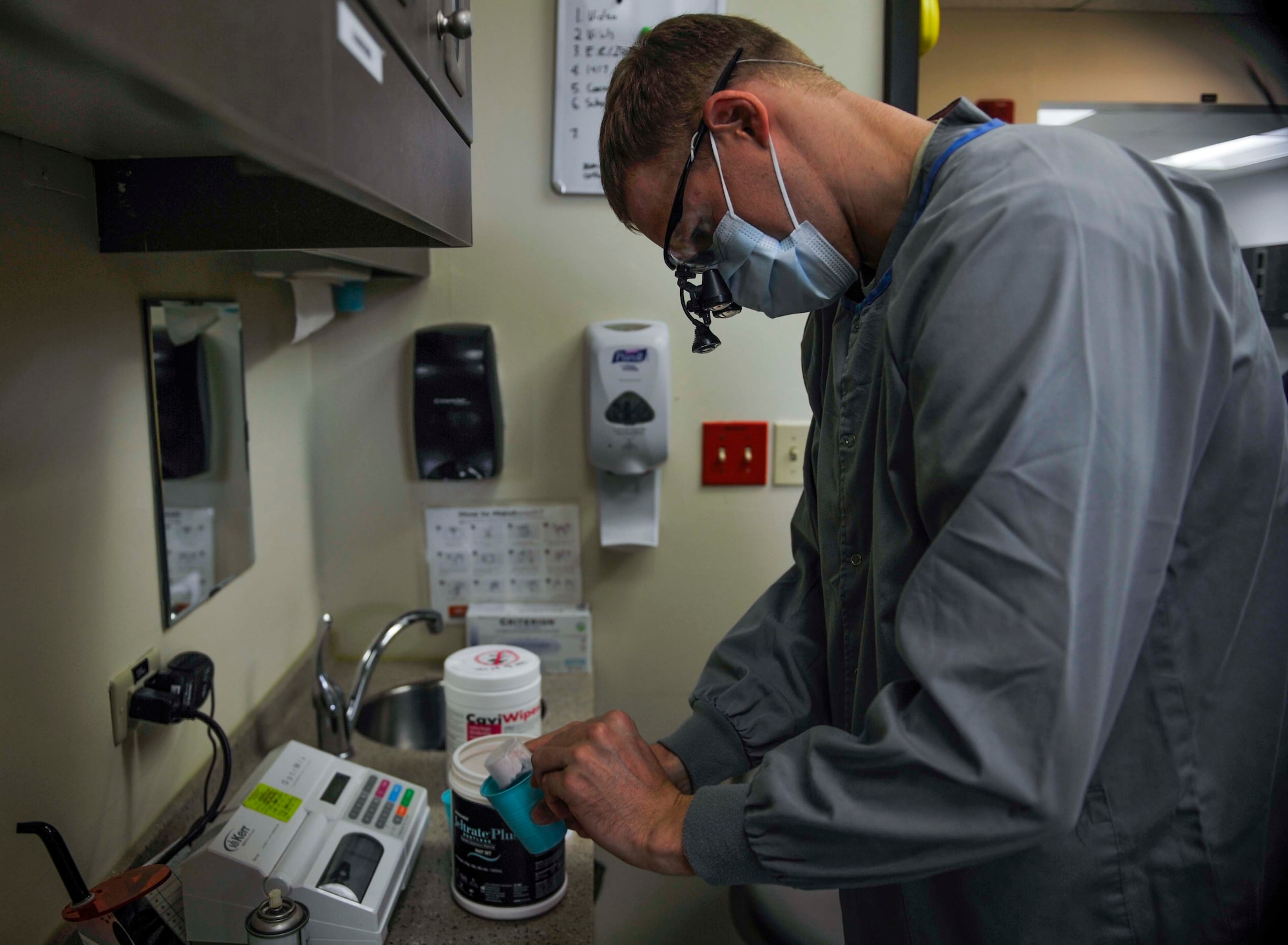 Dr. Ryan Gustafson, 51st Dental Squadron general dentist, pours alginate into a cup before mixing with water to make a mouth guard on Osan Air Base, Republic of Korea, July 31, 2014. Mouth guards can take between 30 minutes and three hours to complete. (U.S. Air Force photo/Senior Airman David Owsianka)