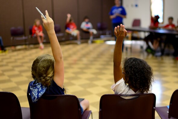 Incoming students ask their more experienced peers questions during a student panel at the Student Connection Round-Up Aug. 1, 2014 at Cannon Air Force Base, N.M. The round-up was designed to help military children at Cannon build new friendships before the start of the school year. (U.S. Air Force Photo/Airman 1st Class Shelby Kay-Fantozzi)