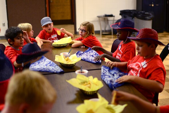 Old and new friends gather for a taco lunch at the Student Connection Round-Up Aug. 1, 2014 at Cannon Air Force Base, N.M. The round-up was designed to help military children at Cannon build new friendships before the start of the school year. (U.S. Air Force Photo/Airman 1st Class Shelby Kay-Fantozzi)