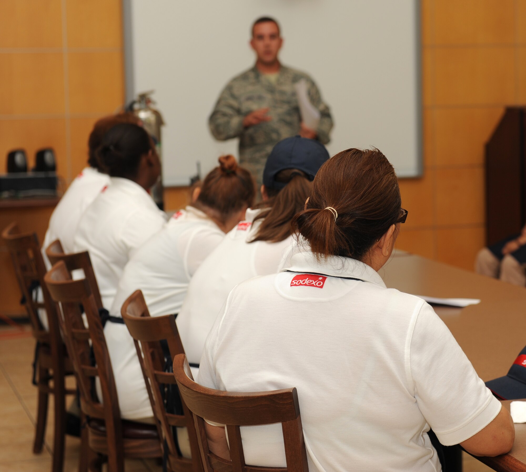 U.S. Air Force Staff Sgt. Christopher Johnston, 7th Civil Engineer Squadron fire prevention inspector, briefs Longhorn Dining Facility employees on fire safety July 30, 2014, at Dyess Air Force Base, Texas. The best way for the fire prevention inspectors to disseminate information about fire safety is through briefings, which are given to all Airmen upon their arrival to Dyess and by request. (U.S. Air Force photo by Airman 1st Class Autumn Velez/Released)
