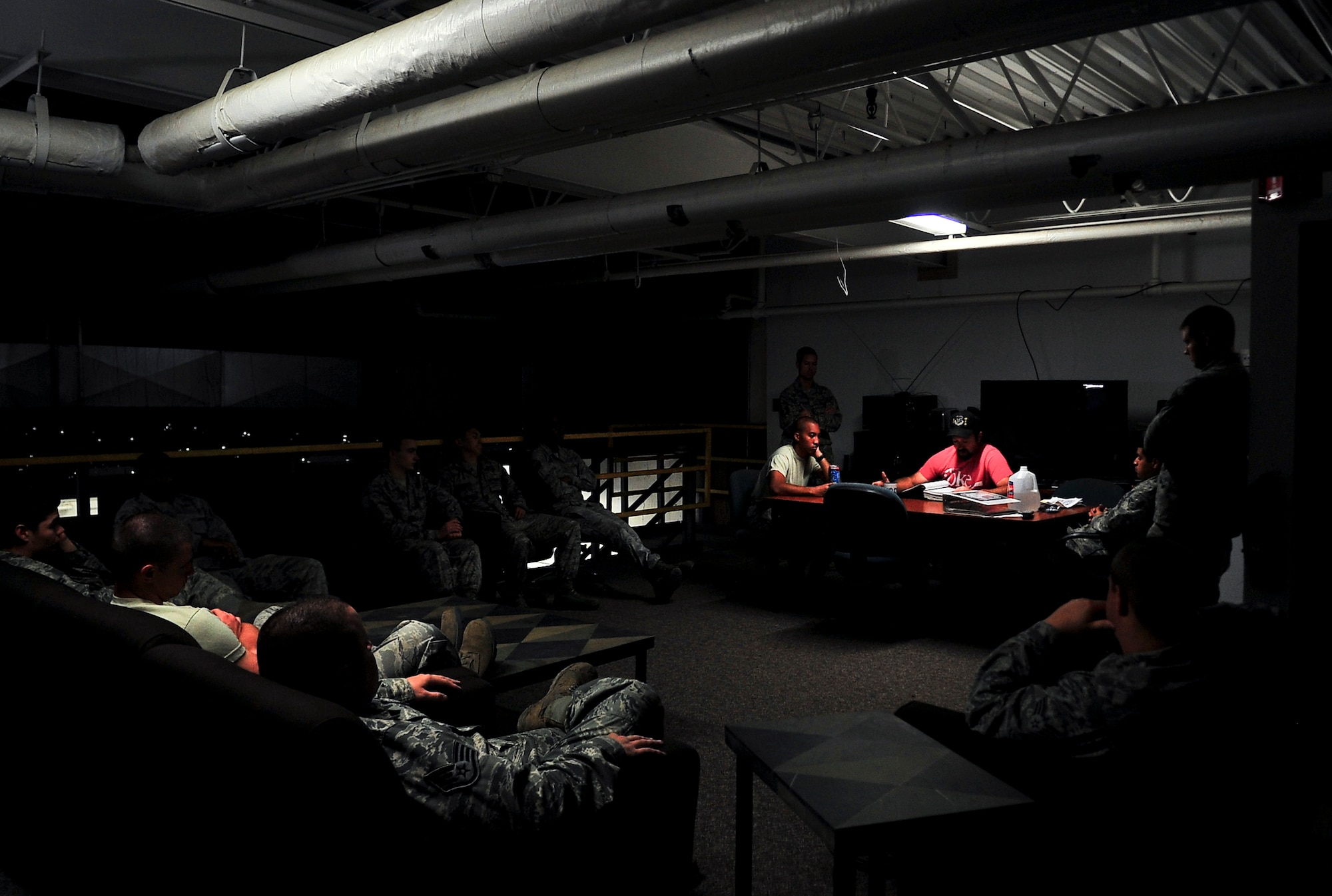 Airmen from the 91st Missile Maintenance Squadron hardened intersite cable system section, receive a briefing on Minot Air Force Base, N.D., July 31, 2014. Their primary mission is to maintain the HICS network, comprised of 1,535 linear miles of cable and 47 cable air dryers spanning across 8,500 square miles of land. (U.S. Air Force photo/Senior Airman Brittany Y. Bateman)
