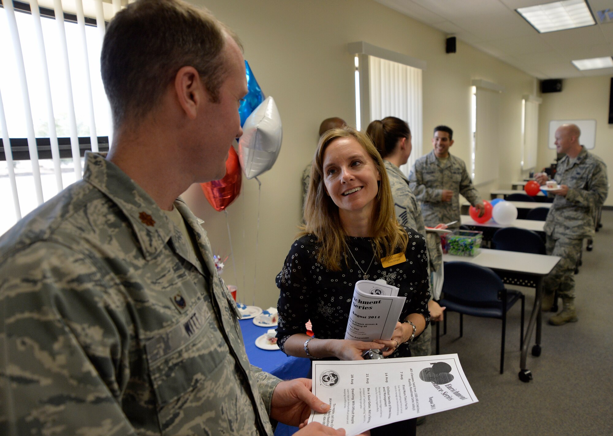 Visitors enjoy the Creech Airman & Family Readiness Center’s new location during the grand opening event July 31, 2014, at Creech Air Force Base, Nev. The new location includes a larger classroom, private offices and free Wi-Fi to allow the A&FRC to provide enhanced services to Creech Airmen and their families. (U.S. Air Force photo by Tech. Sgt. Shad Eidson/Released)