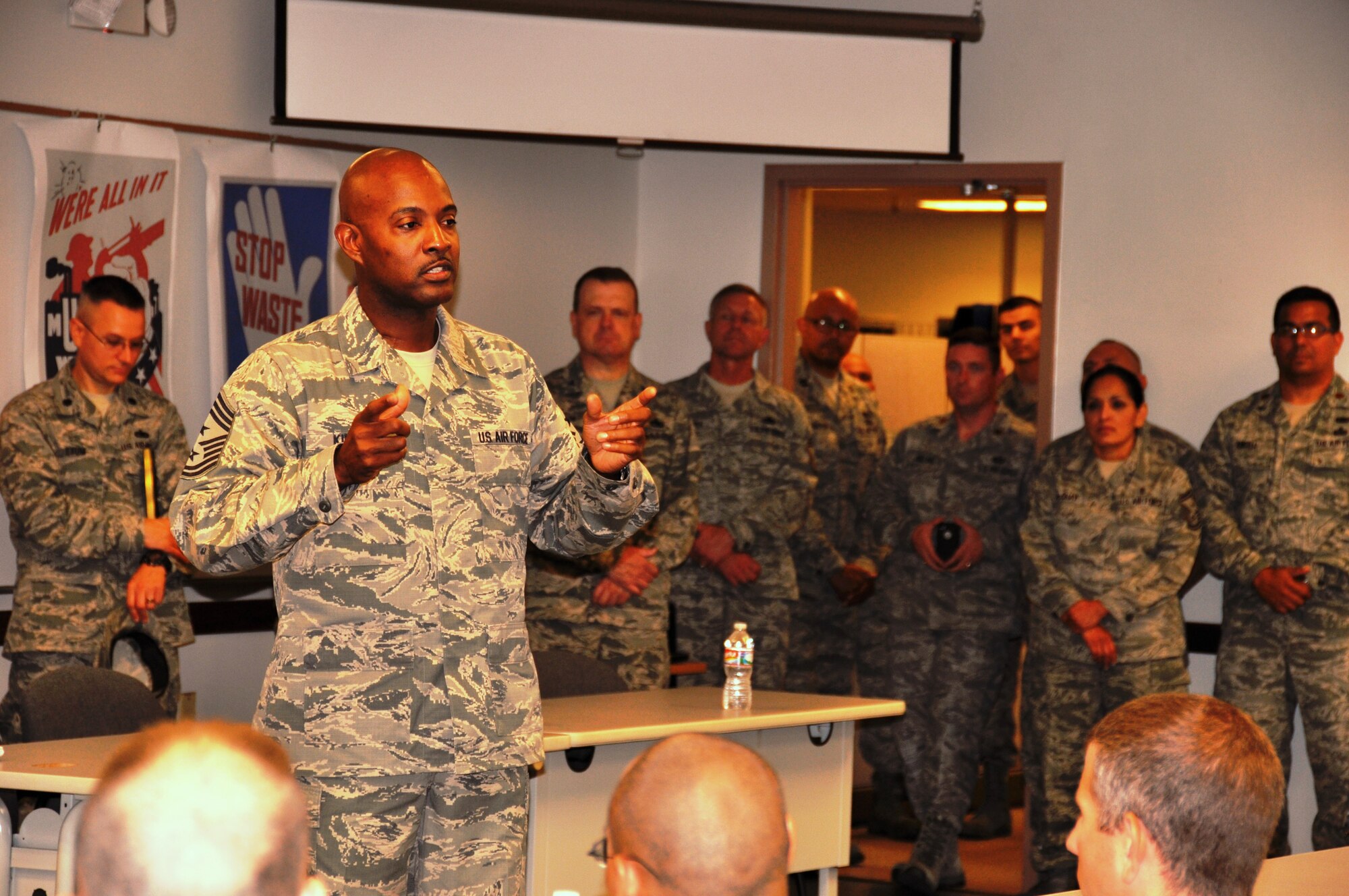 Command Chief Master Sgt. Cameron Kirksey, Air Force Reserve Command, Robins Air Force Base, Georgia, answers questions from the Airmen from the 26th and 74th Aerial Port Squadrons, Joint Base San Antonio-Lackland, Texas.  During his visit, Kirksey also spoke about teamwork, training and the new evaluation system that will replace the Enlisted Performance Review for Airmen. (U.S. Air Force photo by Tech. Sgt. Carlos J. Trevino)