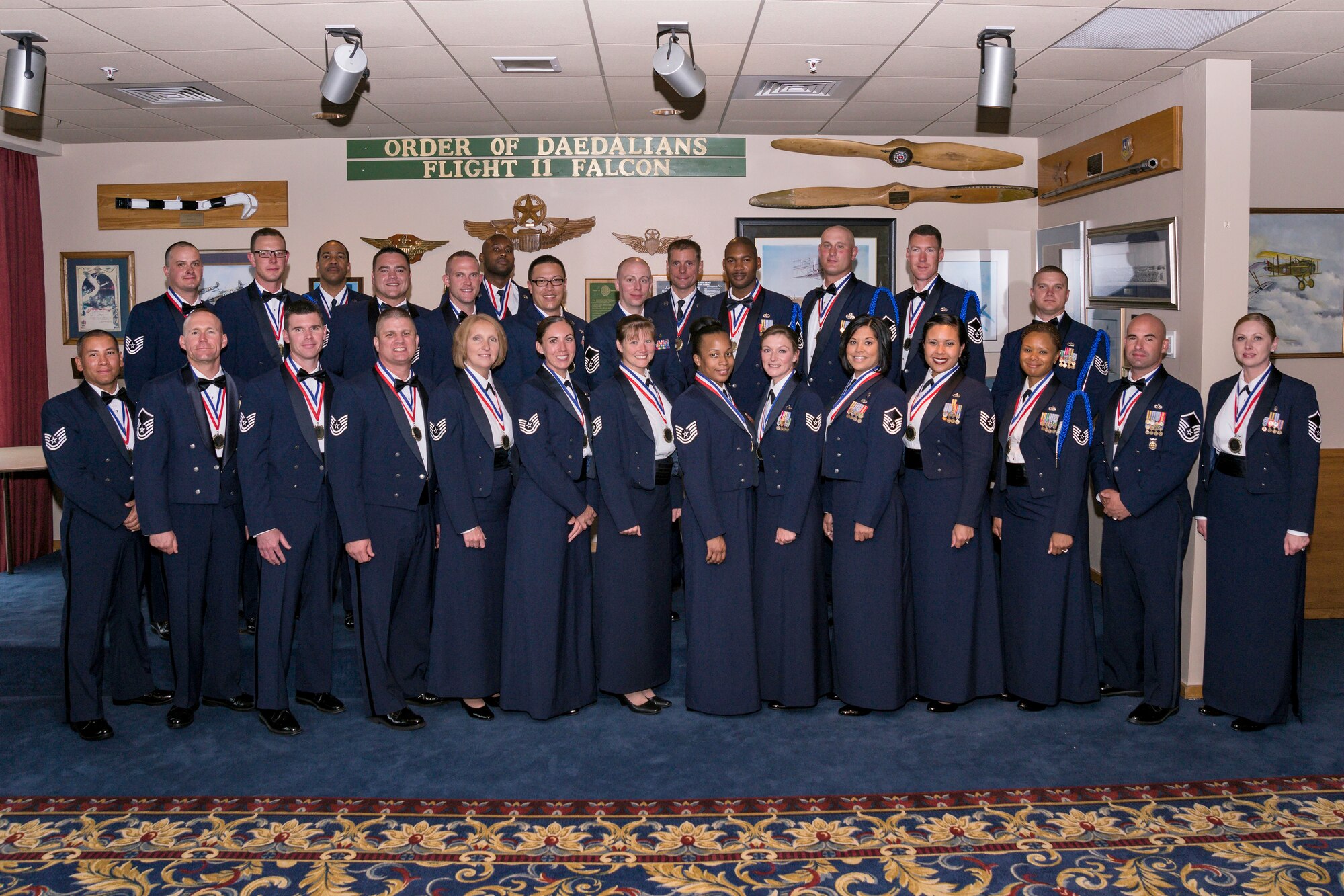 More than two dozen master sergeants here started their weekend with a stately ceremony Friday night at the Falcon Club: official induction into the senior NCO corps. (U.S. Air Force photo/Liz Copan)