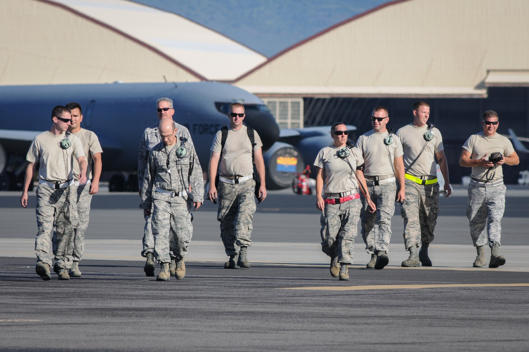Maintenance reservists from the 513th Air Control Group at Tinker Air Force Base, Oklahoma, walk off the flight line after launching an E-3 Sentry Airborne Warning and Control System aircraft July 24 at Joint Base Pearl Harbor-Hickam, Hawaii. More than 60 reservists from the 513th Air Control Group traveled from Tinker to participate in the Rim of the Pacific, or RIMPAC, 2014 exercise, the world’s largest maritime exercise held biannually in and around the Hawaiian islands. (U.S. Air Force photo by Staff Sgt. Caleb Wanzer)