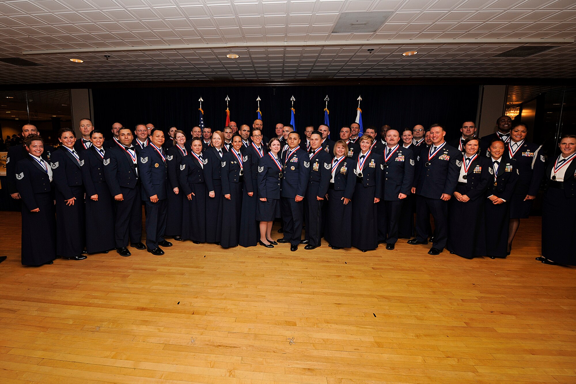 PETERSON AIR FORCE BASE, Colo. – Team Peterson held its annual senior NCO induction ceremony July 25 at The Club. Col. John Shaw, 21st Space Wing commander, Chief Master Sgt. of the Air Force James Cody and Chief Master Sgt. Idalia Peele, 21st SW command chief, welcomed more than 40 senior NCOs to their new rank and responsibilities. (U.S. Air Force photo/Dennis Howk)