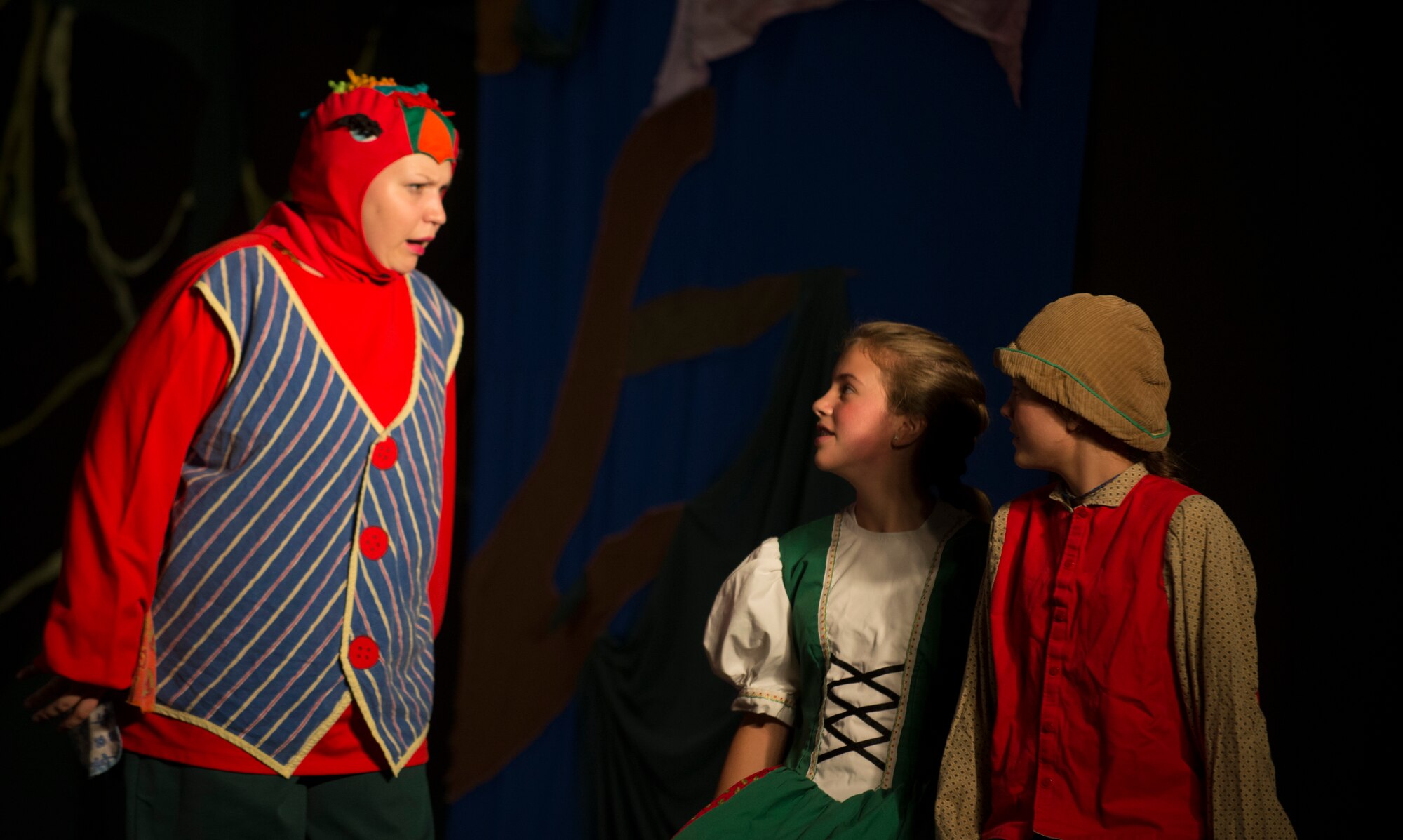 Performers from Moody’s Youth Programs act on stage during a theater play at Moody Air Force Base, Ga., Aug. 1, 2014.  The actors practiced more than 10 hours before performing live. (U.S. Air Force photo by Airman 1st Class Dillian Bamman/Released)