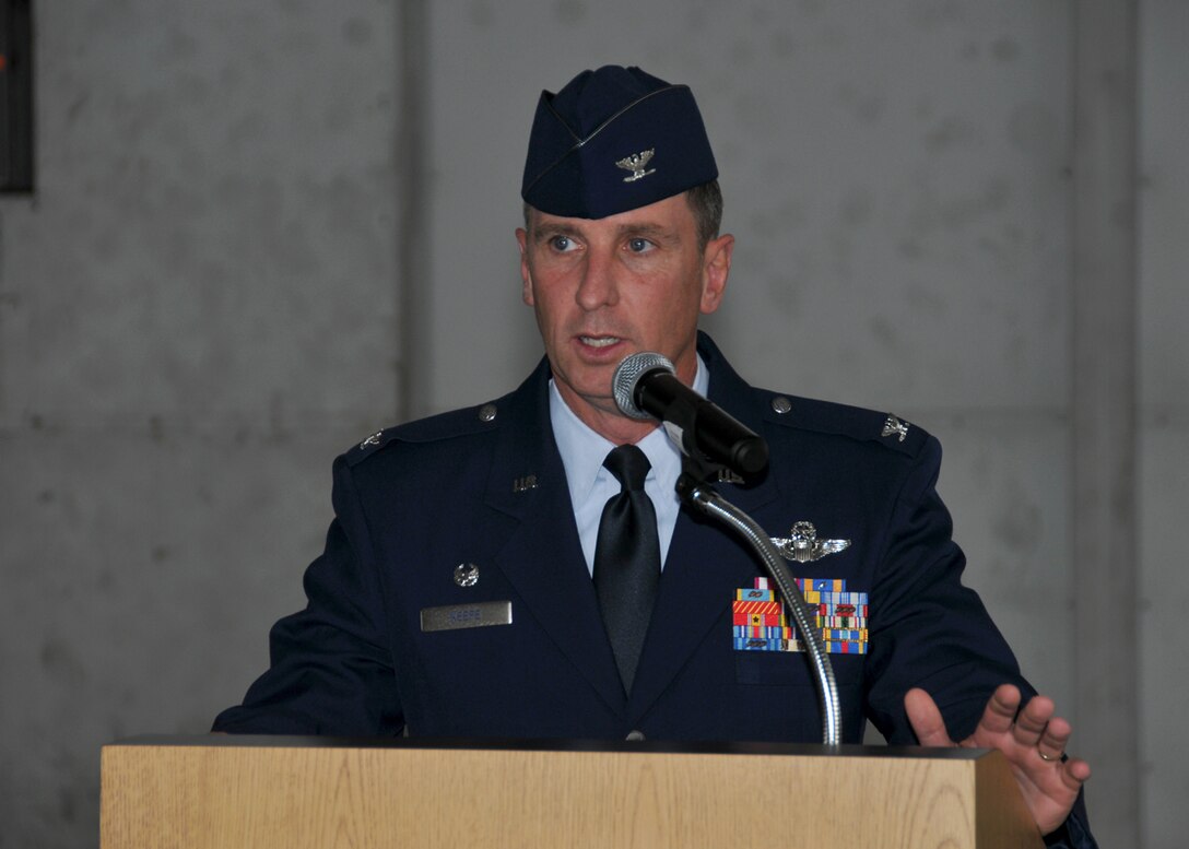 Col. James Keefe, 104th Fighter Wing Commander, speaks at a Commanders 
Call on Aug. 2, 2014, in the main hangar at Barnes Air National Guard Base, Westfield, Mass. 
Col. Keefe congratulated all those honored in the ceremonies preceding his 
presentation, and then went on to review the past year and provide a forecast of the next 
two years. (U.S. Air National Guard photo by Master Sgt. Mark Fortin/Released)