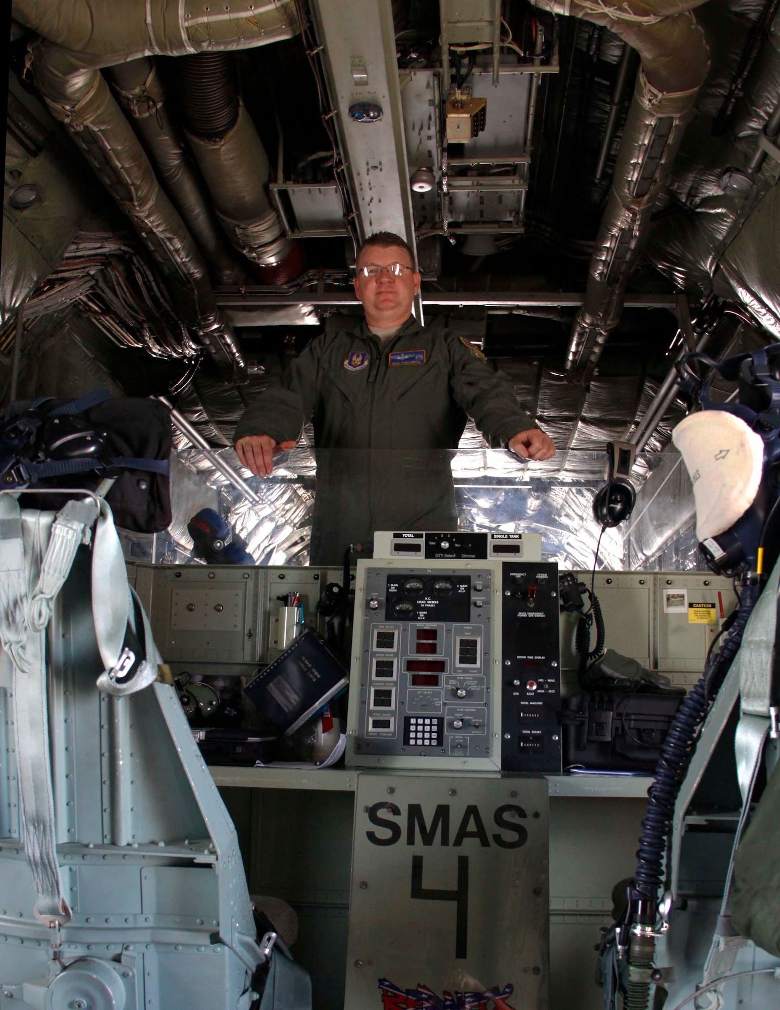 Master Sgt. Rich Lawton, engineer from the 910th Airlift Wing in Youngstown, Ohio, stands in the cargo bay of the C-130 plane at Homestead Air Reserve Base, Fla., July 31.  Lawton is a member of the crew that performed the aerial spray mission to reduce the mosquito population in Homestead and the surrounding Miami-Dade County. (U.S. Air Force photo by/Senior Airman Jaimi L. Upthegrove)