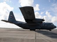 The 910th Airlift Wing's C-130 Hercules cargo plane sits as a static display at 
Homestead Air Reserve Base, Fla., July 31. The plane was used to distribute
Dibrom to reduce the mosquito population in Homestead and the surrounding Miami-Dade County.  (U.S. Air Force photo by/Senior Airman Aja Heiden)

