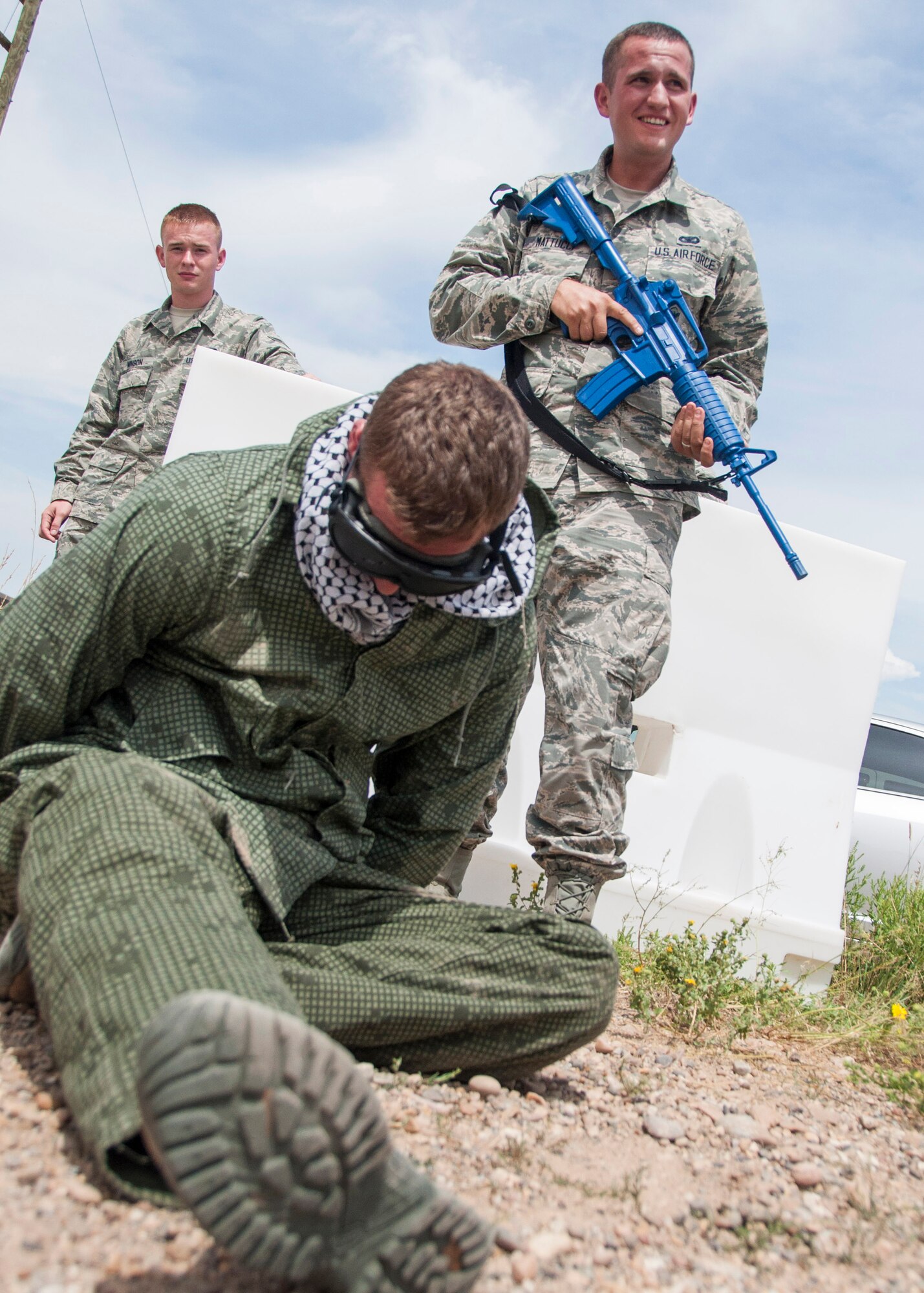 Airman Basic Matthew Mattucci, 419th Security Forces Squadron, stands guard over an enemy prisoner played by Tech. Sgt. David Hasseler. (U. S. Air Force photo/Staff Sgt. Crystal Charriere)