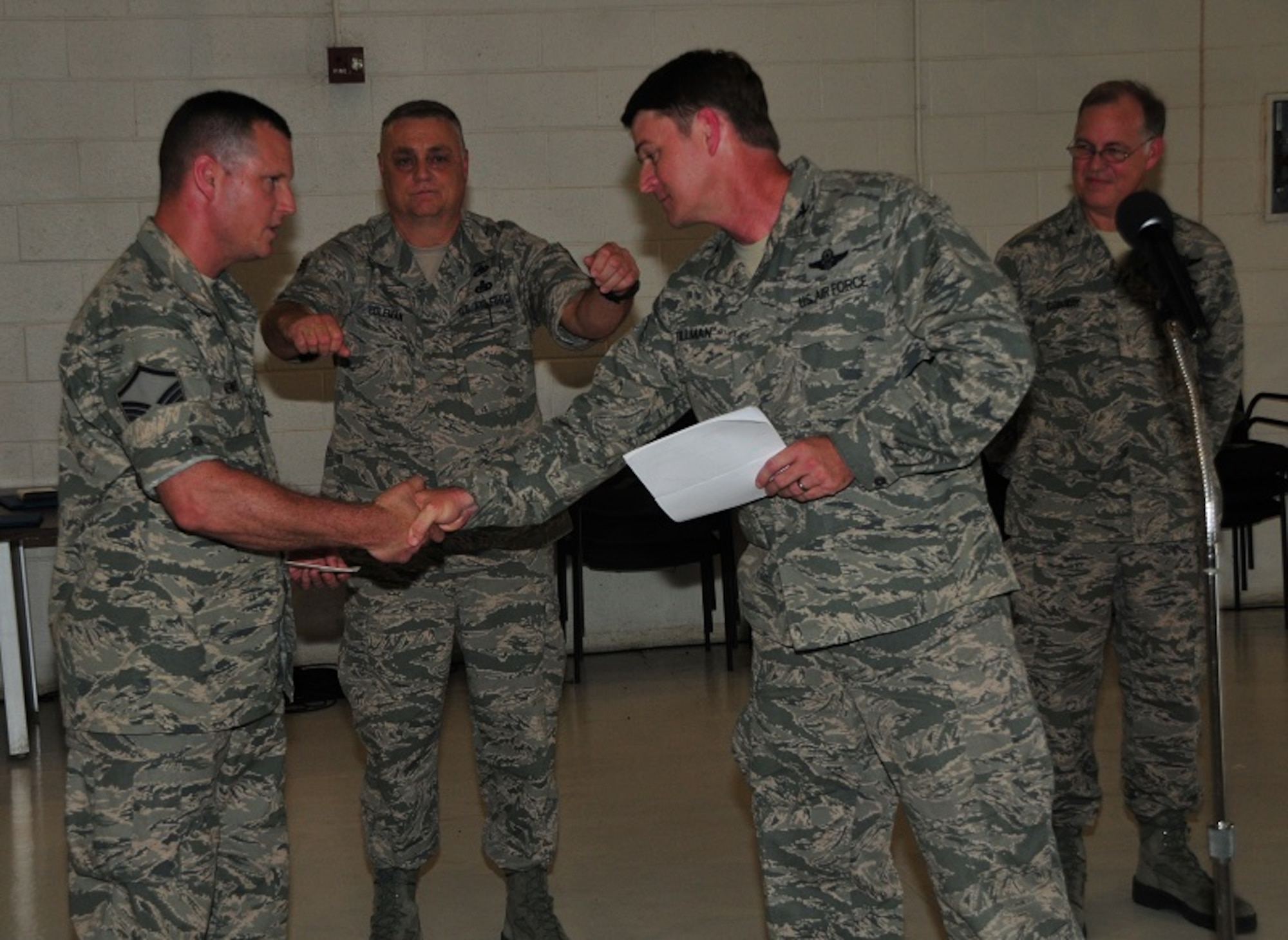 172d Airlift Wing Maintenance Group member, Master Sgt. Brian Kennedy (left) has has been named the Air National Guard's 2013 CMSAF Thomas N. Barnes Crew Chief of the Year Award winner.  Kennedy is shown being congratulated by 172d Vice Wing Commander, Col Tommy Tillman.  The announcement marks the first time that a Mississippi National Guardsmen has won the award.