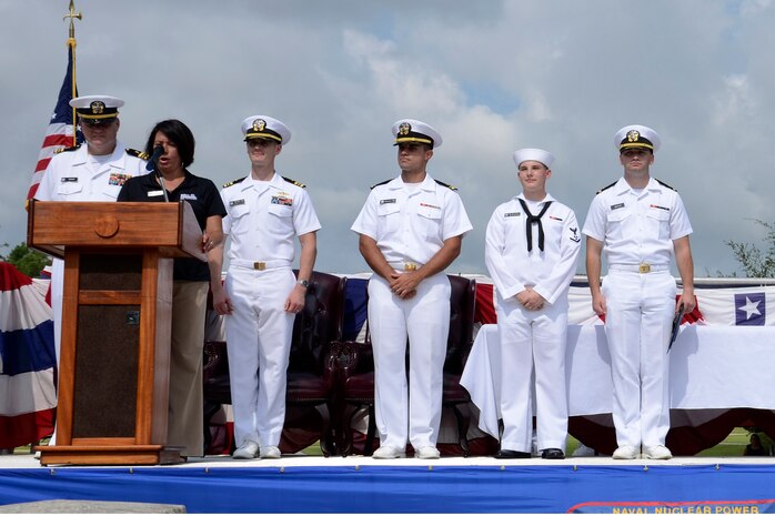 Petty Officer 3rd Class Jacob Welther-Burchett (second from right), and Ens. Edward Butler (right), are recognized as the Naval Nuclear Power Training Command Nuclear Power School class 1403 enlisted and officer honor graduates August 1, 2014, at Joint Base Charleston, S.C. (U.S. Navy photo/Petty Officer 3rd Class Gabriel Villareal)