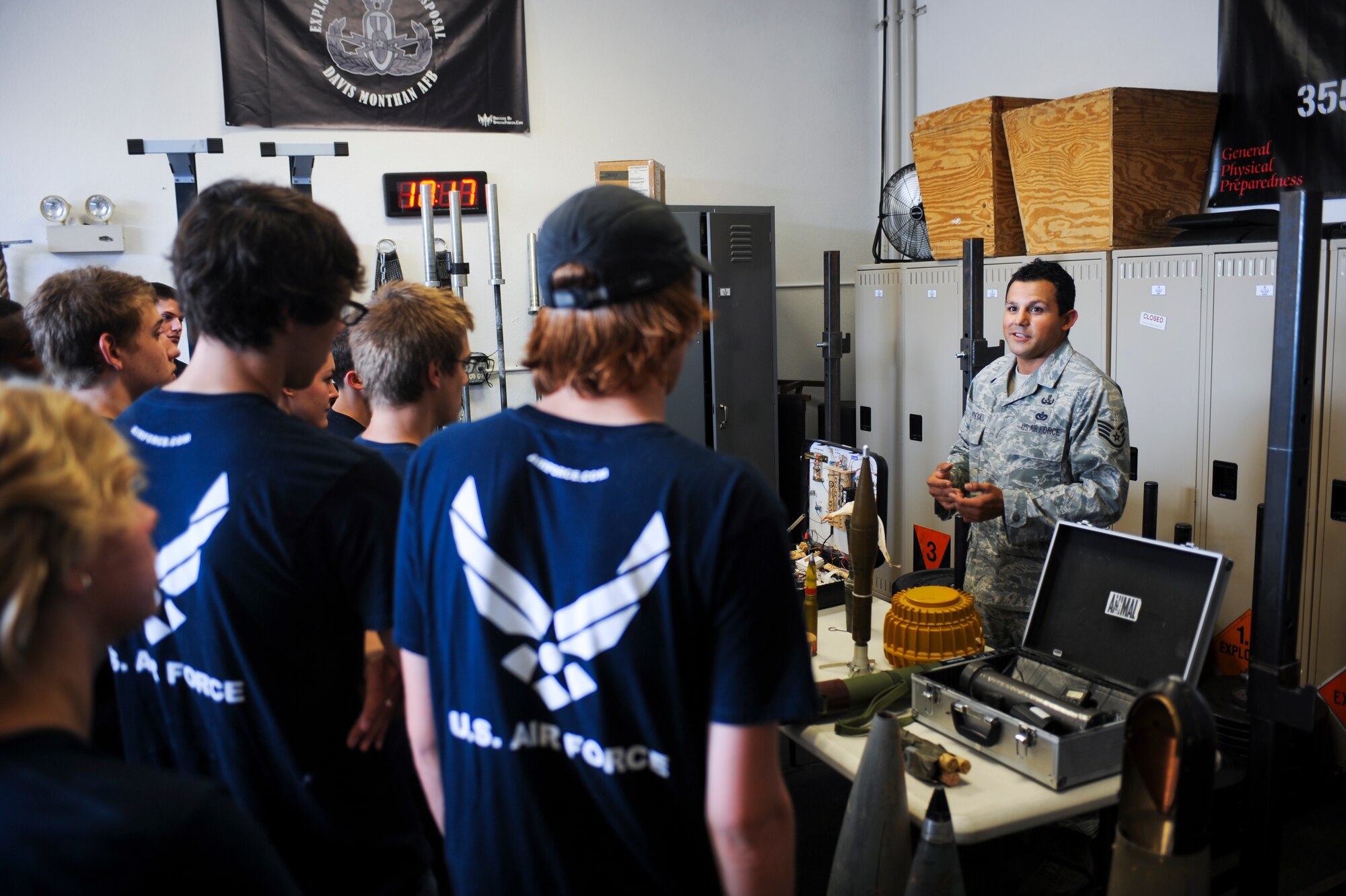 U.S. Air Force Staff Sgt. Oscar Ortega, 355th Civil Engineer Squadron explosive ordnance disposal technician, shows members of the Delayed Enlistment Program various training and operational tools that the EOD members get to use at Davis-Monthan Air Force Base, Ariz., July 29, 2014. The Delayed Enlistment Program is for individuals going to active duty; enlist first into the DEP. (U.S. Air Force photo by Airman 1st Class Sivan Veazie/Released)