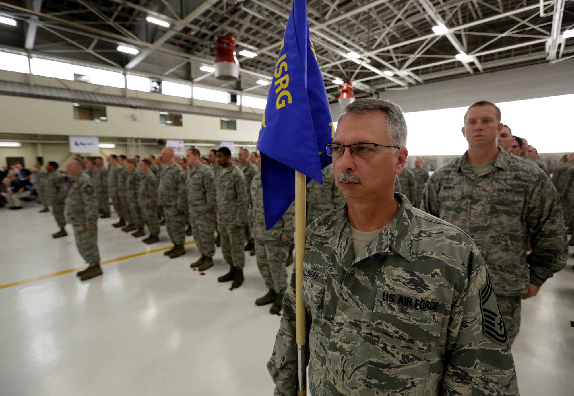 Chief Master Sgt. Tomie Allinder of the 123rd Intelligence Squadron stands in formation with his Airmen during the 188th Wing’s Conversion Day ceremony June 7, 2014, at Ebbing Air National Guard Base, Fort Smith, Arkansas. The 123rd, formerly a geographically separated unit with the Arkansas Air National Guard located at Little Rock Air Force Base, Arkansas, now falls under the 188th Intelligence, Surveillance and Reconnaissance Group of the newly redesignated 188th Wing. The 123rd, comprised of 120 Airmen, will physically move its operation to the 188th over the next two years as part of the 188th’s mission conversion from A-10C Thunderbolt II “Warthogs” to ISR and remotely piloted aircraft. (U.S. Air National Guard photo by Master Sgt. Mark Moore/released)