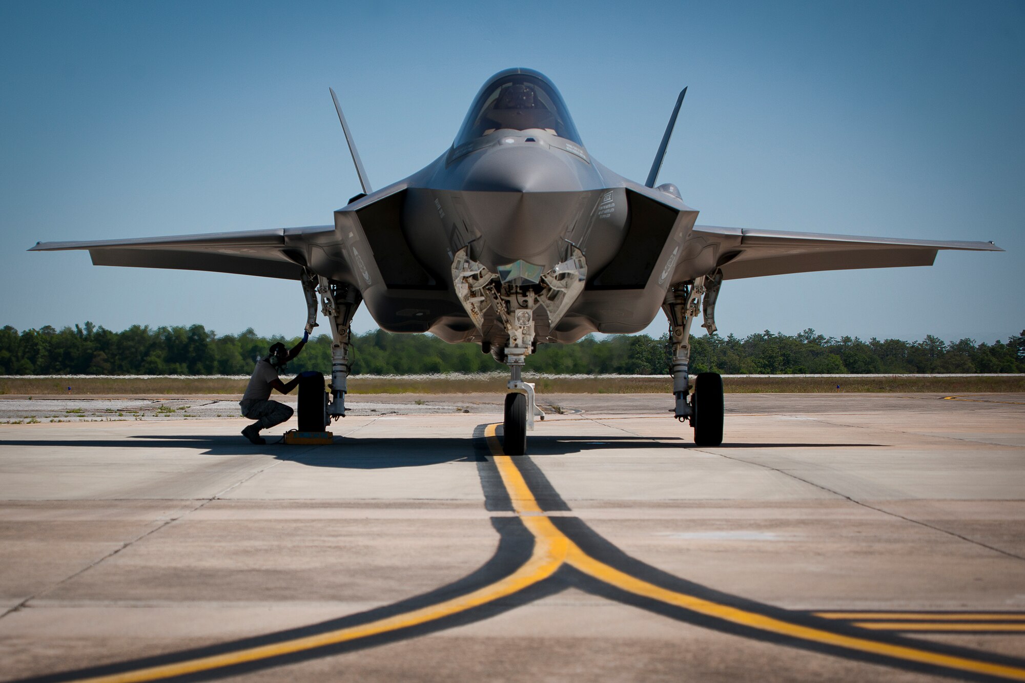 501 - Staff Sgt. Mark Freeman, 33rd Aircraft Maintenance Squadron, performs a post-flight check on the tire of an F-35A Lightning II before refueling it at Eglin Air Force Base, Fla.  All of the F-35 variants use the refueling areas in conjunction with the 96th Logistics Readiness Squadron’s fuels flight.  (U.S. Air Force photo/Samuel King Jr.)