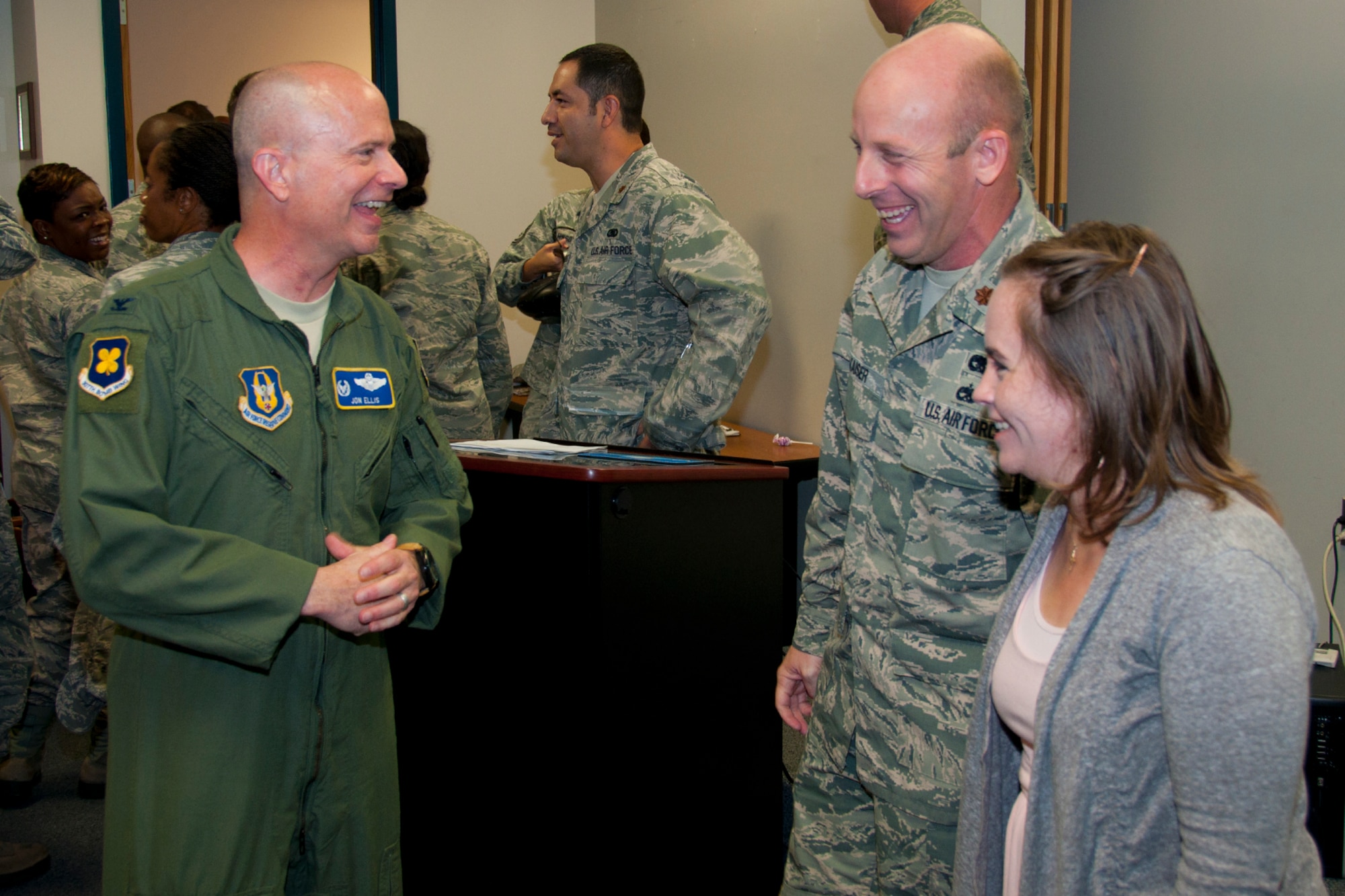 U.S. Air Force Maj. Jody Kaiser, 307th Logistics Readiness Squadron commander and his wife, Julie, share a light moment with Col. Jonathan Ellis, 307th Bomb Wing commander, at Barksdale Air Force Base, La., Aug. 2, 2014.   Ellis was on hand to congratulate Kaiser for assuming command of the 307th LRS.   A large contingent of airmen, family and friends were on hand to wish Kaiser well with the new command. (U.S. Air Force photo by Tech. Sgt. Ted Daigle/Released)