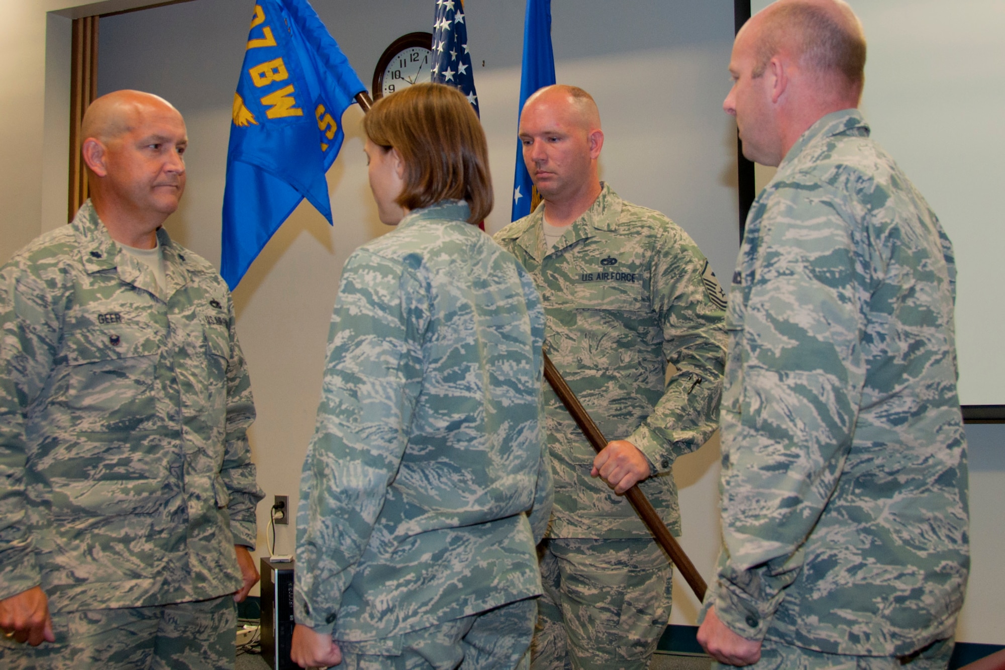 U.S. Air Force Lt. Col. Mark Geer, 307th Mission Support Group deputy commander, listens as Maj. Silke A. Tietje, outgoing 307th Logistics Readiness Squadron commander relinquishes command to Maj. Jody Kaiser, incoming 307th LRS commander, at Barksdale Air Force Base, La., Aug. 2, 2014.  The change of command marked a new milestone in the career of Kaiser who has been a reservist at Barksdale AFB for more than 20 years.  He originally started out in the enlisted ranks for 12 years prior to being commissioned. (U.S. Air Force photo by Tech. Sgt. Ted Daigle/Released)