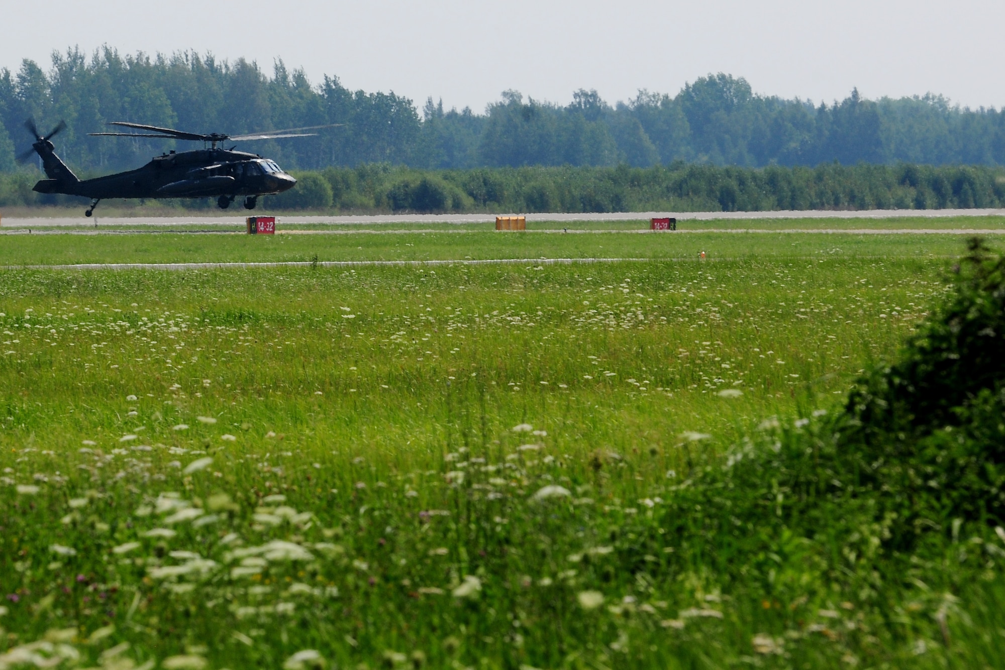 A U.S. Army UH-60 Blackhawk helicopter lands at Siauliai Air Base, Lithuania, July 29, 2014. The Black Hawk, along with Army Soldiers, partnered with Lithuanian Forces to conduct bilateral training to improve readiness, maintain regional security and build a partnership capacity. (U.S. Air Force photo by Staff Sgt. Jarad A. Denton/Released)