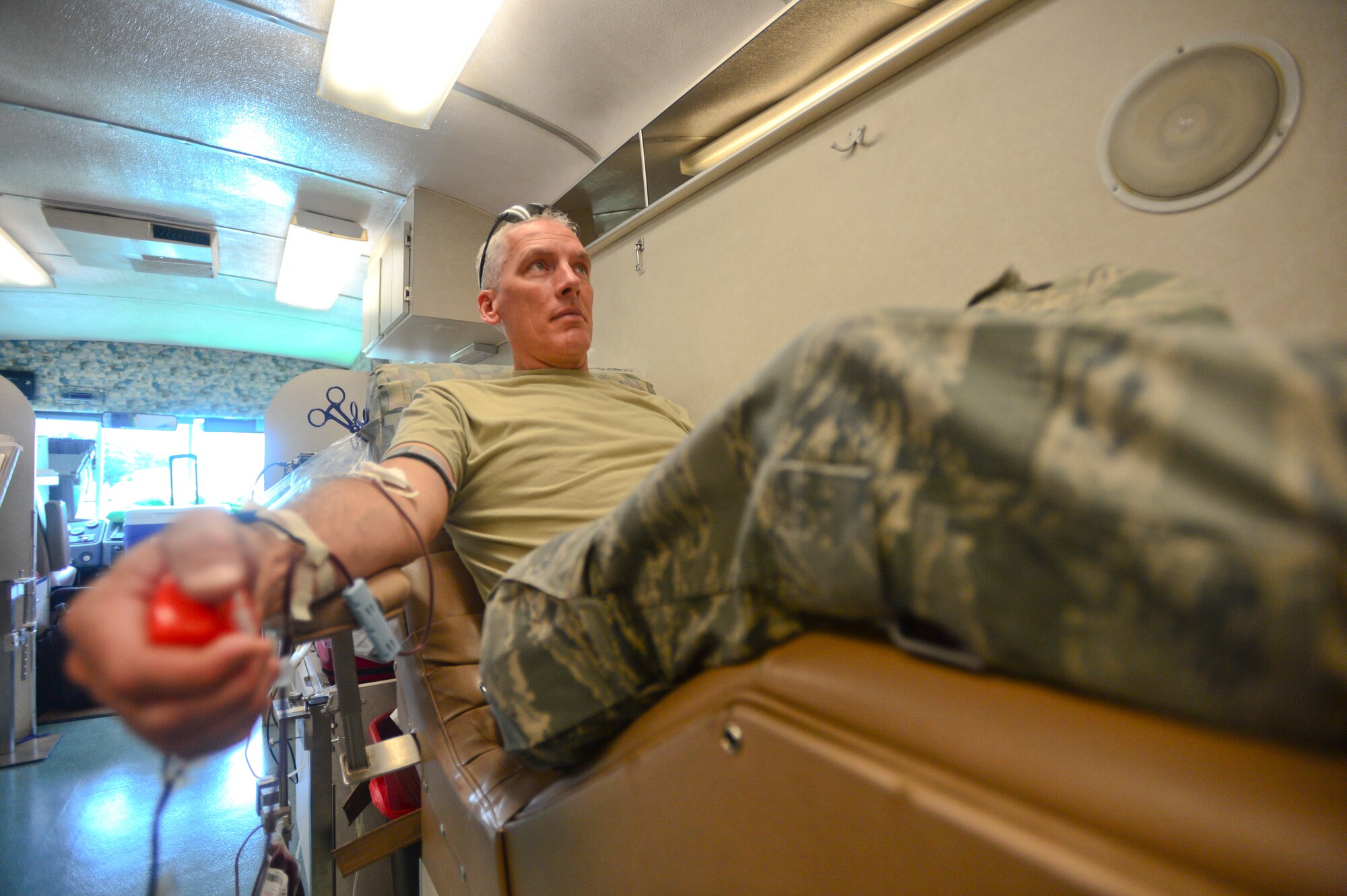 Staff Sgt. Daniel Griswold, an antenna specialist with the 205th Engineering Squadron, participates in a blood drive August 2 at Will Rogers Air National Guard Base, Oklahoma City. Members were encouraged to donate blood during their drill weekend to the Oklahoma Blood Institute, an organization that supplies blood to hospitals in Oklahoma and surrounding areas. (U.S. Air Force photo by Airman 1st Class Tyler Woodward/released) 