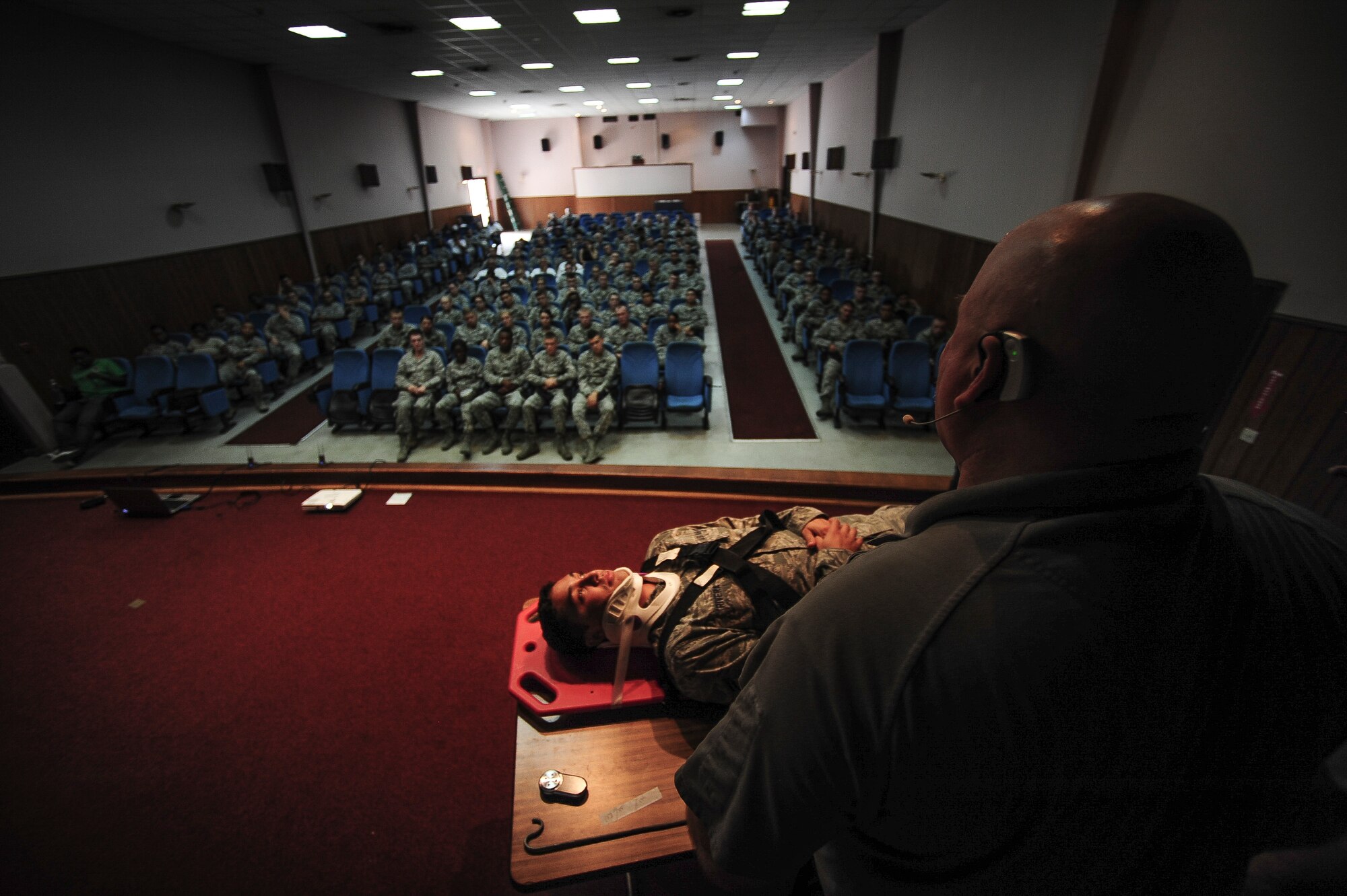 Greg McCarty, Tampa Firefighter and presenter of Street Smart from Florida Stay Alive From Education Inc., briefs Airmen that are 26 and under, during a Street Smart presentation Aug. 1, 2014, Incirlik Air Base Turkey. The firefighters put an Airman through a simulated vehicle accident that was a result of distracted driving under the influence of alcohol. (U.S. Air Force photo by Senior Airman Nicole Sikorski/Released)