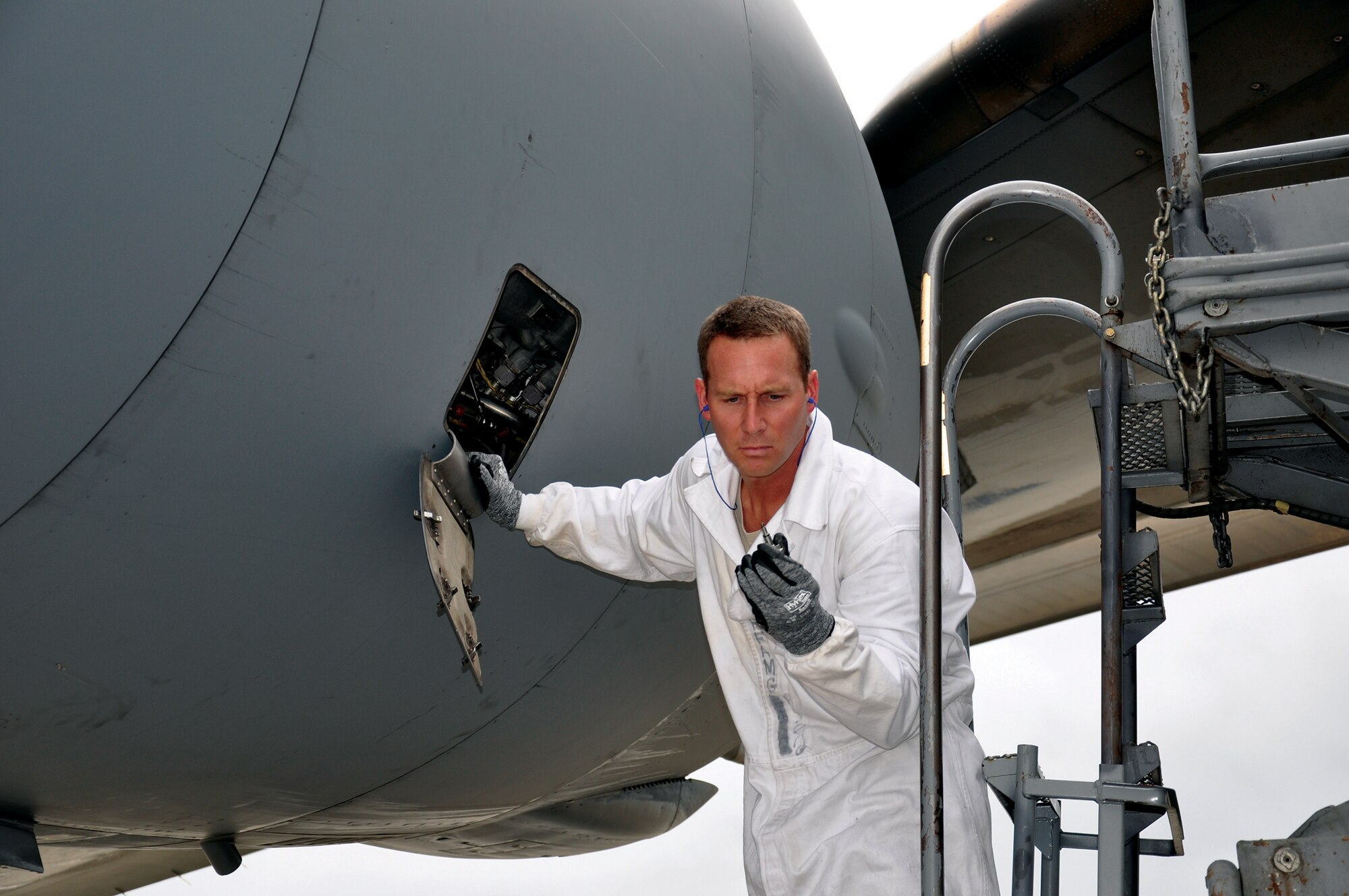 RAMSTEIN AIR BASE, Germany - Staff Sgt. Steve Billingsly, 445th Aircraft Maintenance Squadron C-17 Globemaster III crew chief, checks engine parts as part of a basic post post-op flight July 10, 2014. The 445 AMXS sent 20 maintainers to Germany to serve annual tour time July 7-21. (U.S. Air Force photo/Capt. Elizabeth Caraway)