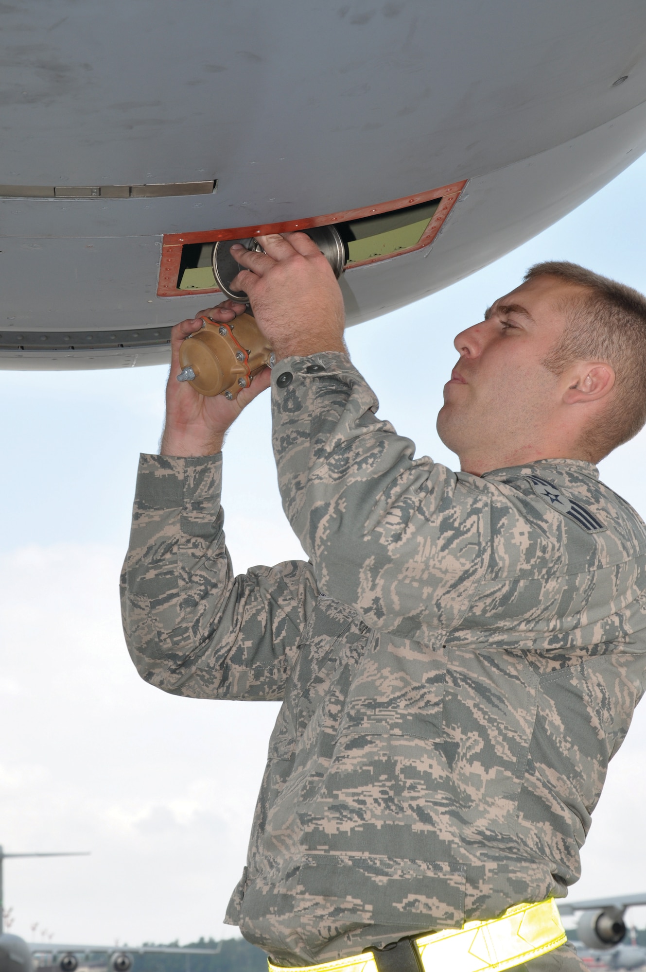 RAMSTEIN AIR BASE, Germany - Senior Airman Brandon Fisher, 445 Aircraft Maintenance Squadron electrician, replaces an anti-ice valve in a C-17 Globemaster III July 10. The 445 AMXS sent 20 maintainers to Germany to serve annual tour time July 7-21. (U.S. Air Force photo/Capt. Elizabeth Caraway)