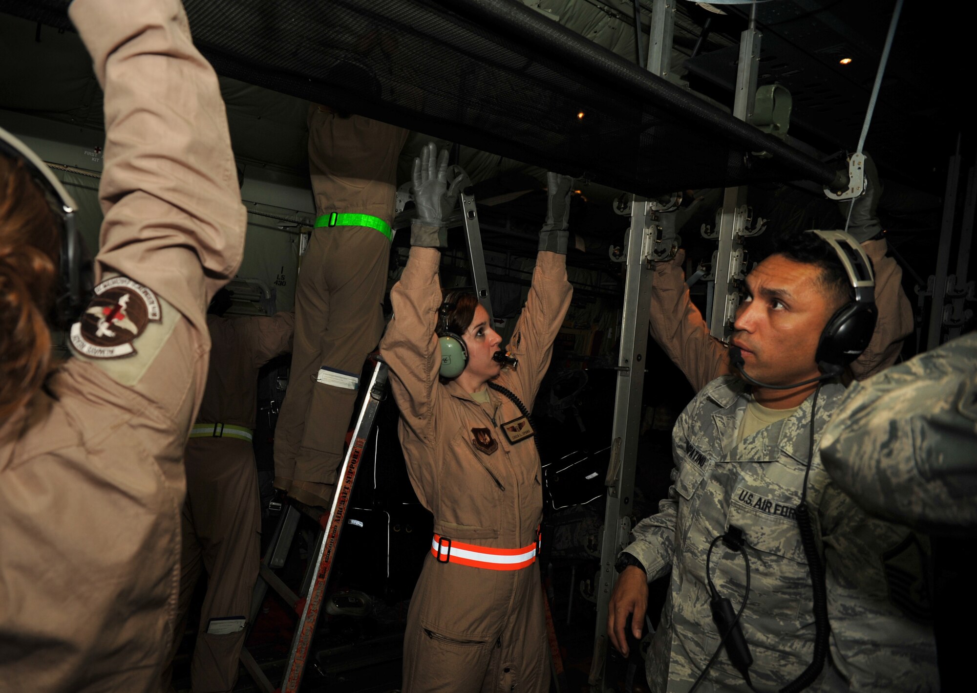 Airmen from the 86th Aeromedical Evacuation Squadron and 86th Medical Squadron convert a C-130J Super Hercules into a flying critical care unit, July 26, 2014. There was enough medical supplies and equipment necessary to perform surgery on the aircraft. (U.S. Air Force photo/Senior Airman Hailey Haux)