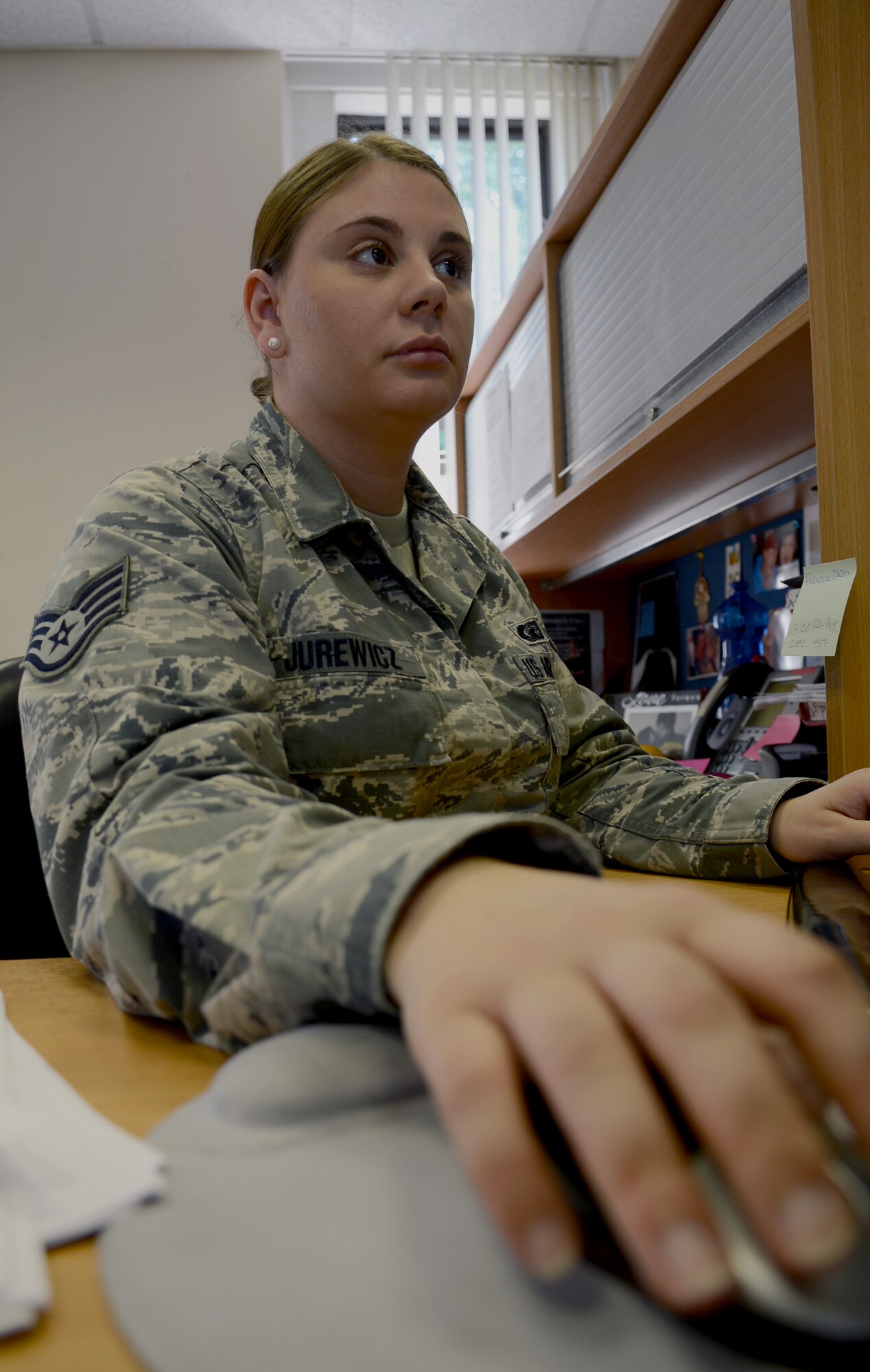 U.S. Air Force Staff Sgt. Bobbi Jurewicz, 100th Comptroller Squadron customer service technician from Sanderson, Texas, validates basic allowance for housing recertification forms July 29, 2014, on RAF Mildenhall, England. Jurewicz earned the Square D Spotlight for exhibiting the Air Force Core Value of Excellence in All We Do. (U.S. Air Force photo/Airman 1st Class Kyla Gifford/Released) 