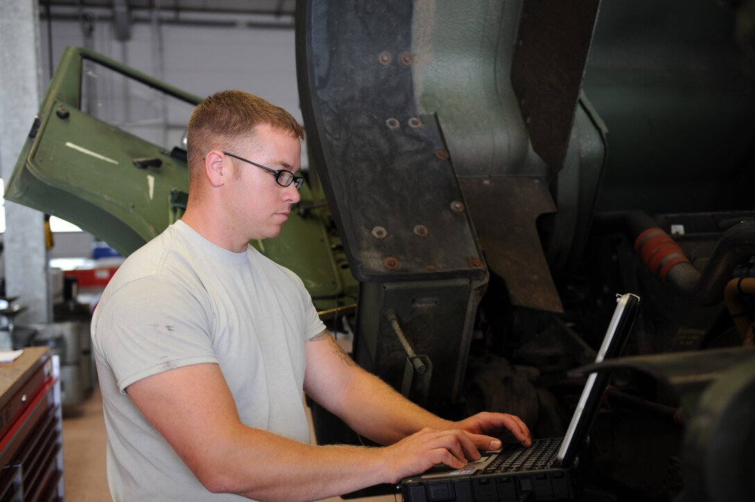 U.S. Air Force Staff Sgt. Shayne Kusserow, a 606th Air Control Squadron vehicle maintenance journeyman from Las Cruces, N.M., troubleshoots on a five-ton truck July 30, 2014, at his squadron at Spangdahlem Air Base, Germany. The vehicle maintenance shop maintains 173 vehicles, including humvees and five-ton trucks, assigned to the 606th ACS. (U.S. Air Force photo by Airman 1st Class Dylan Nuckolls/Released)