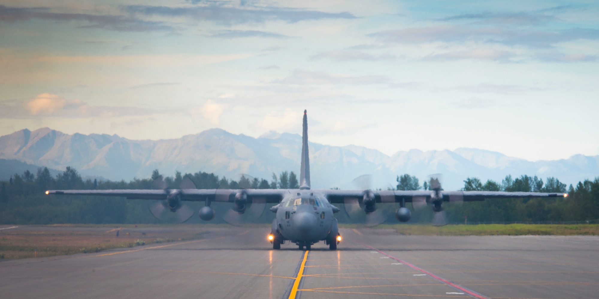A C-130 Hercules from the 36th Airlift Squadron taxies down the flightline during a training sortie Aug. 1, 2014 at Joint Base Elmendorf-Richardson, Alaska. The 36 AS travelled to JBER for off-station training prior to Exercise Red Flag. (U.S. Air Force photo by Staff Sgt. Chad C. Strohmeyer/Released)