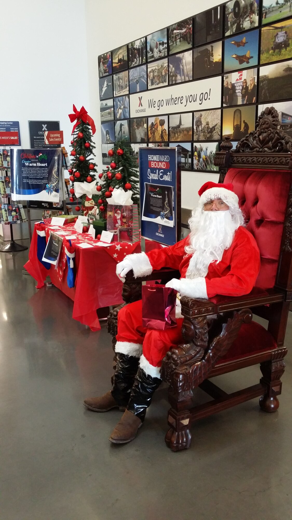 U.S. Air Force Master Sgt. Mark Cutler, 52nd Component Maintenance Squadron first sergeant from Rome, N.Y., dressed as Santa Claus during an Operation Warm Heart event July 27, 2014, in the Exchange at Spangdahlem Air Base, Germany. Santa and his elves handed out more than 160 gifts in values ranging from $10 to $100 to Airmen and families. (U.S. Air Force courtesy photo/Released)